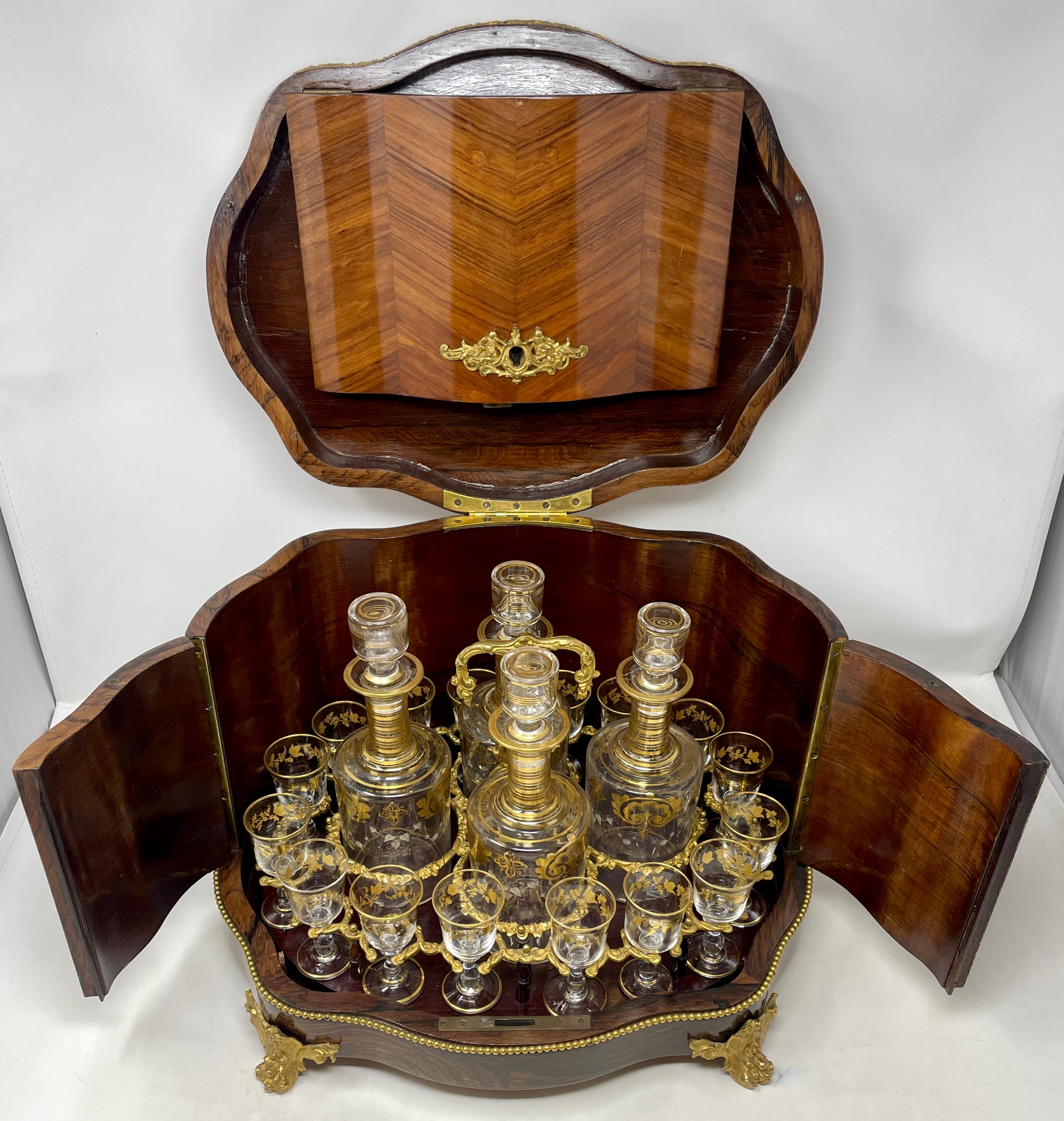 Superb antique French baccarat crystal and gold bronze Cave À Liqueur in fitted satinwood case, circa 1885-1890.