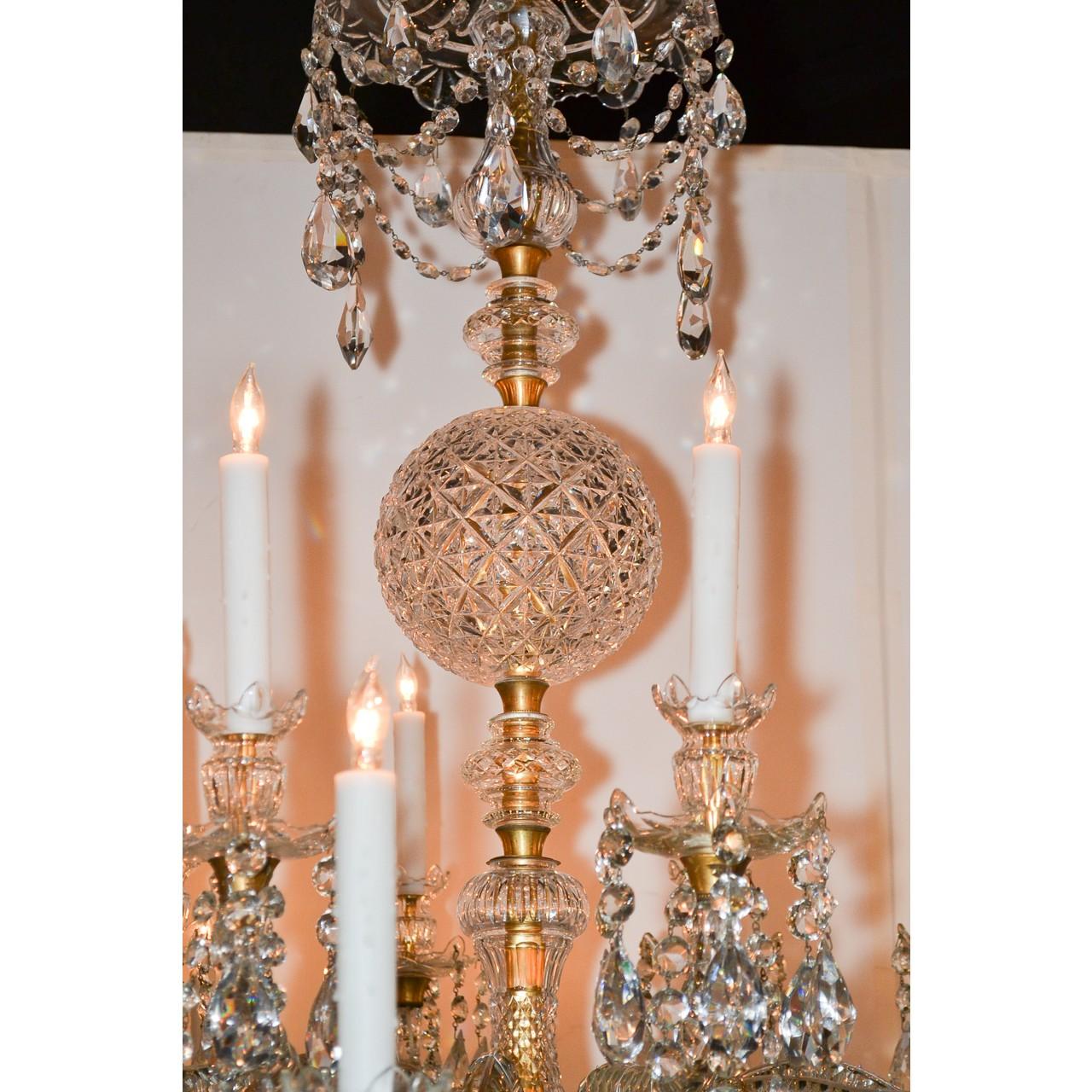 Incomparable and palatial antique French Baccarat crystal 20-light chandelier. The dome-shaped crystal crown with dangles of faceted almond-shaped prisms and crystal bead swags. The central stem accented with an eye-catching diamond pattern cut