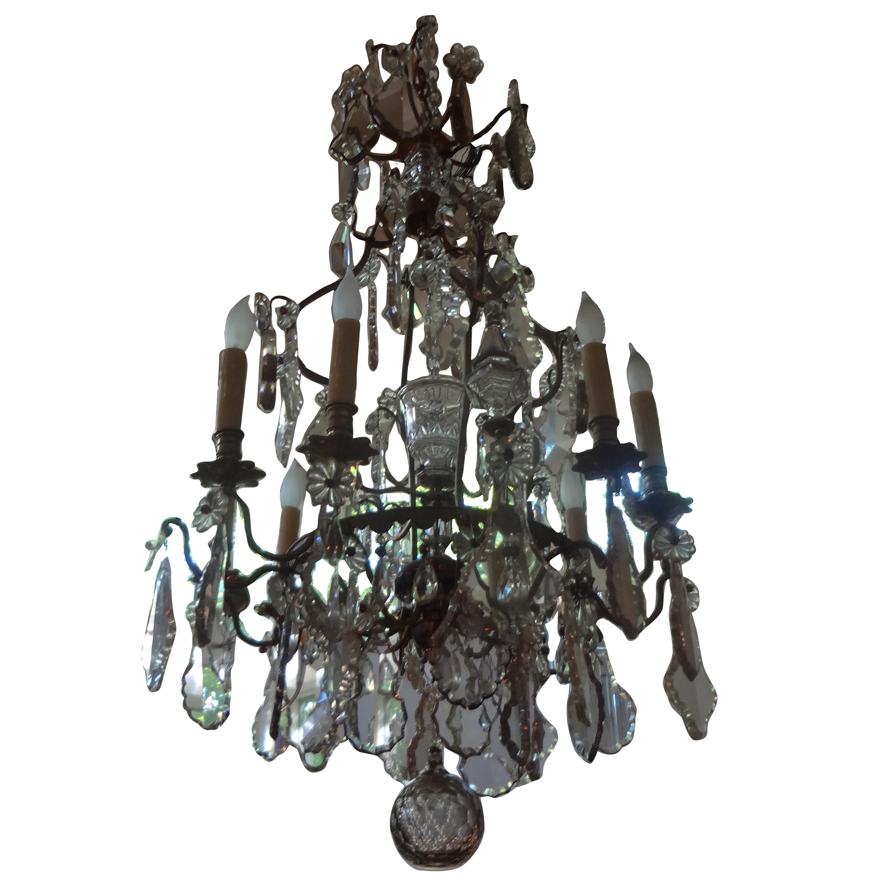 Antique French Baccarat style bronze and crystal chandelier.
Unusual antique French Louis XVI style 8-light crystal chandelier, circa 1920. This stunning large antique French crystal chandelier, possibly Baccarat, has been newly wired and can be
