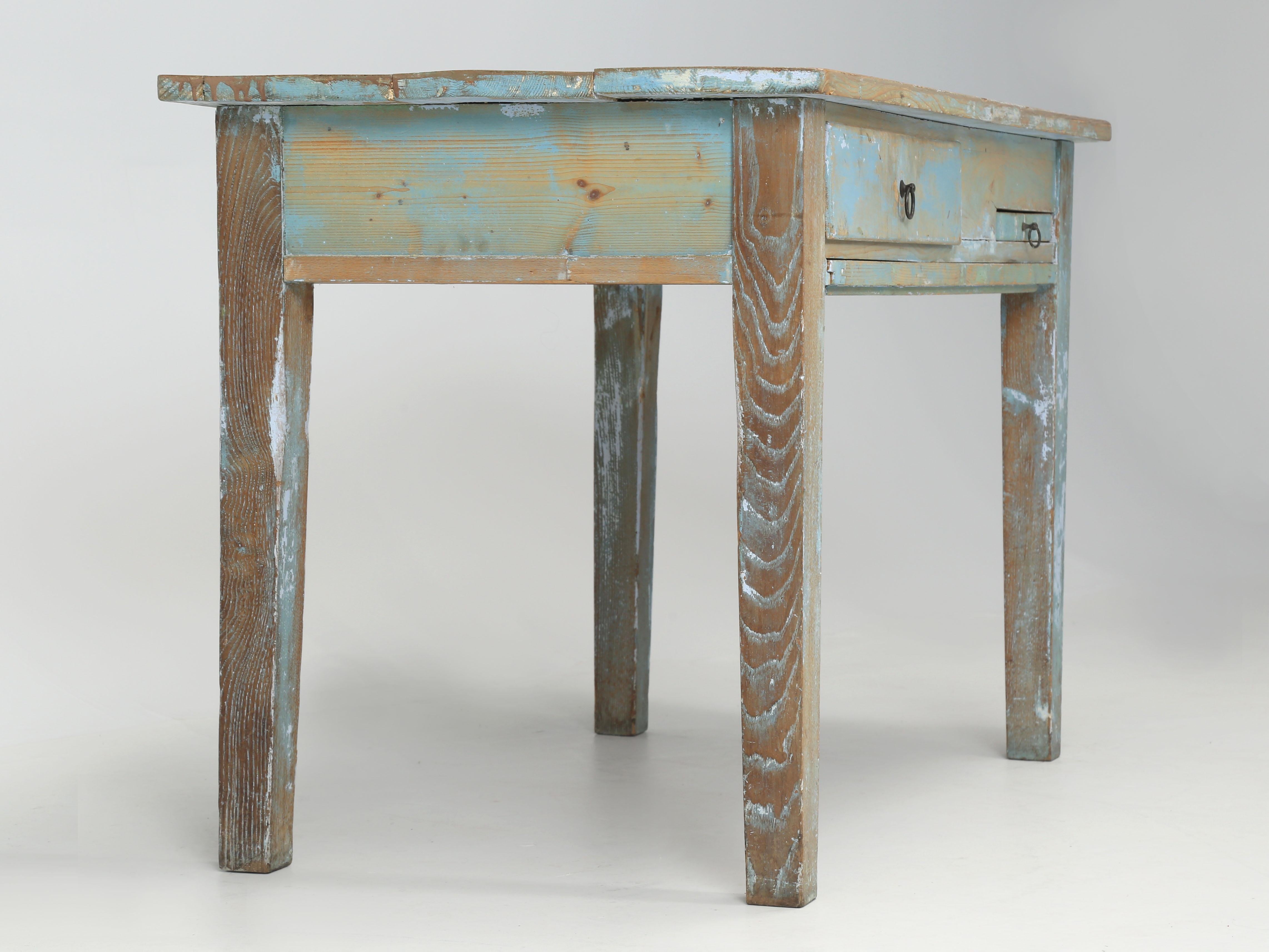 This could be one of the most unique tables we have ever offered for sale in our 30-year history. What you are looking at is an antique French (we think) baking table, which must have had a marble top at one point. The antique baking table is