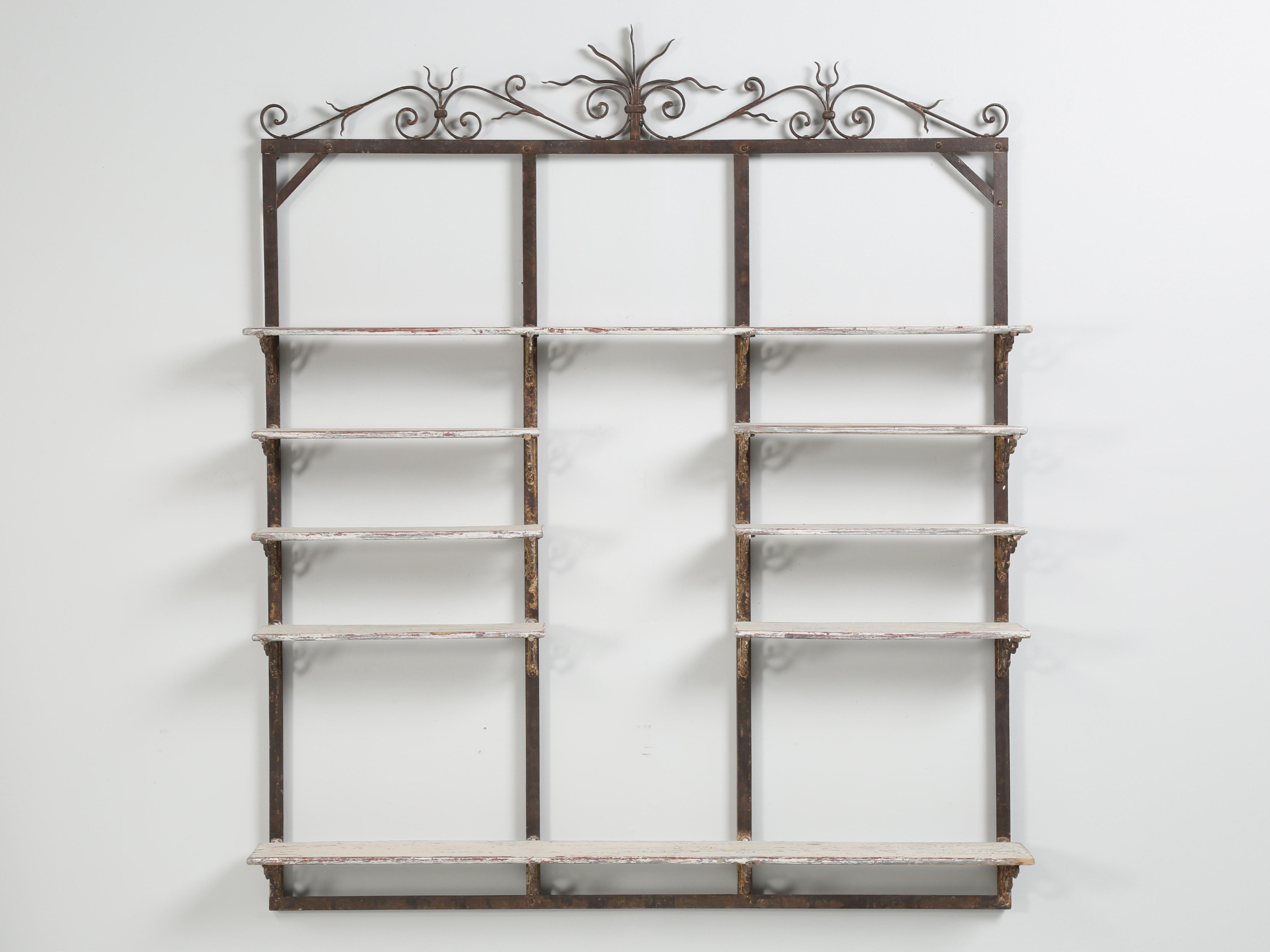 Antique French wall-mounted Commercial Display Rack or Shelf Unit that was previously used in a French Bakery from the South of France. Sometimes, when you see an old item, you instantly know it’s the right look. From the Original Patina of this