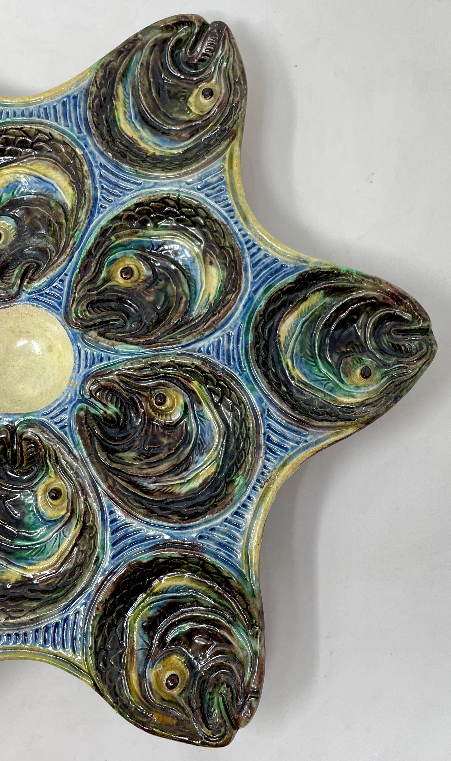 Antique French faience Barbotine Palissy Ware Majolica porcelain fish-head oyster plate, circa 1890.