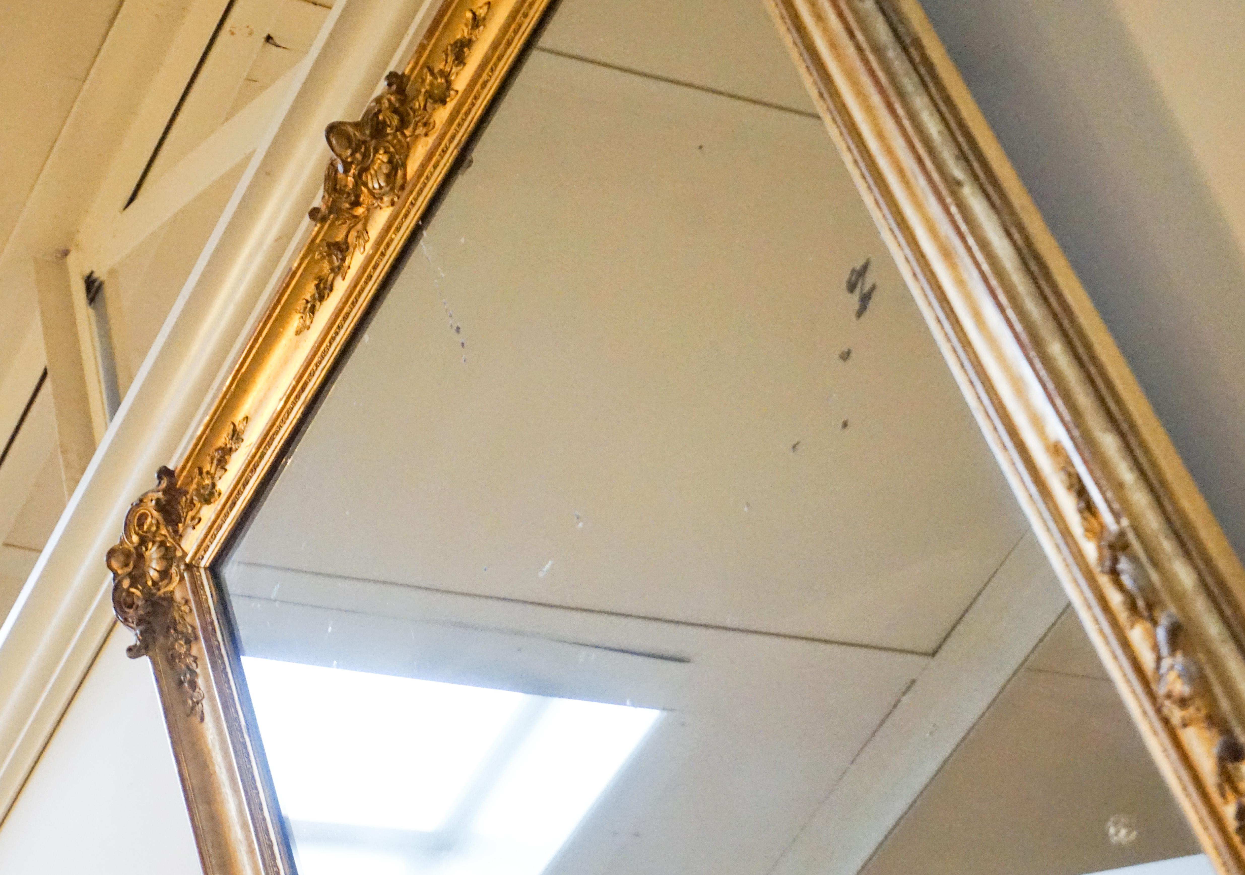 Antique French Baroque gold leaf mirror. 

Origin: France, circa 1870

Measurements: 36'' W x 52.5'' H.