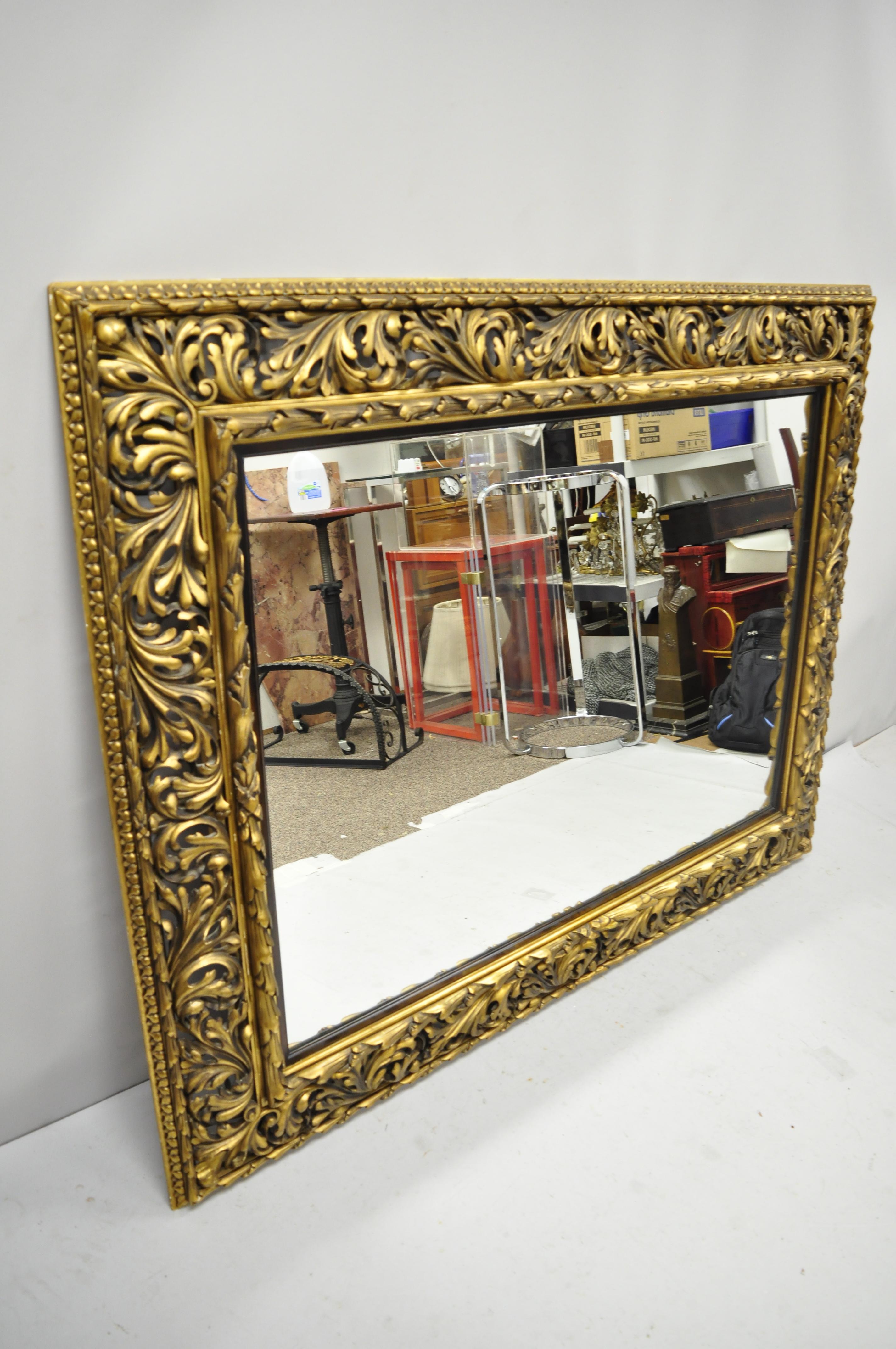 Antique French Baroque Rococo style pierce carved wood large gold mirror. Item features remarkable pierce carved wood frame, burnished gold finish, ornate scrollwork, circa early 20th century. Measurements: 50.75