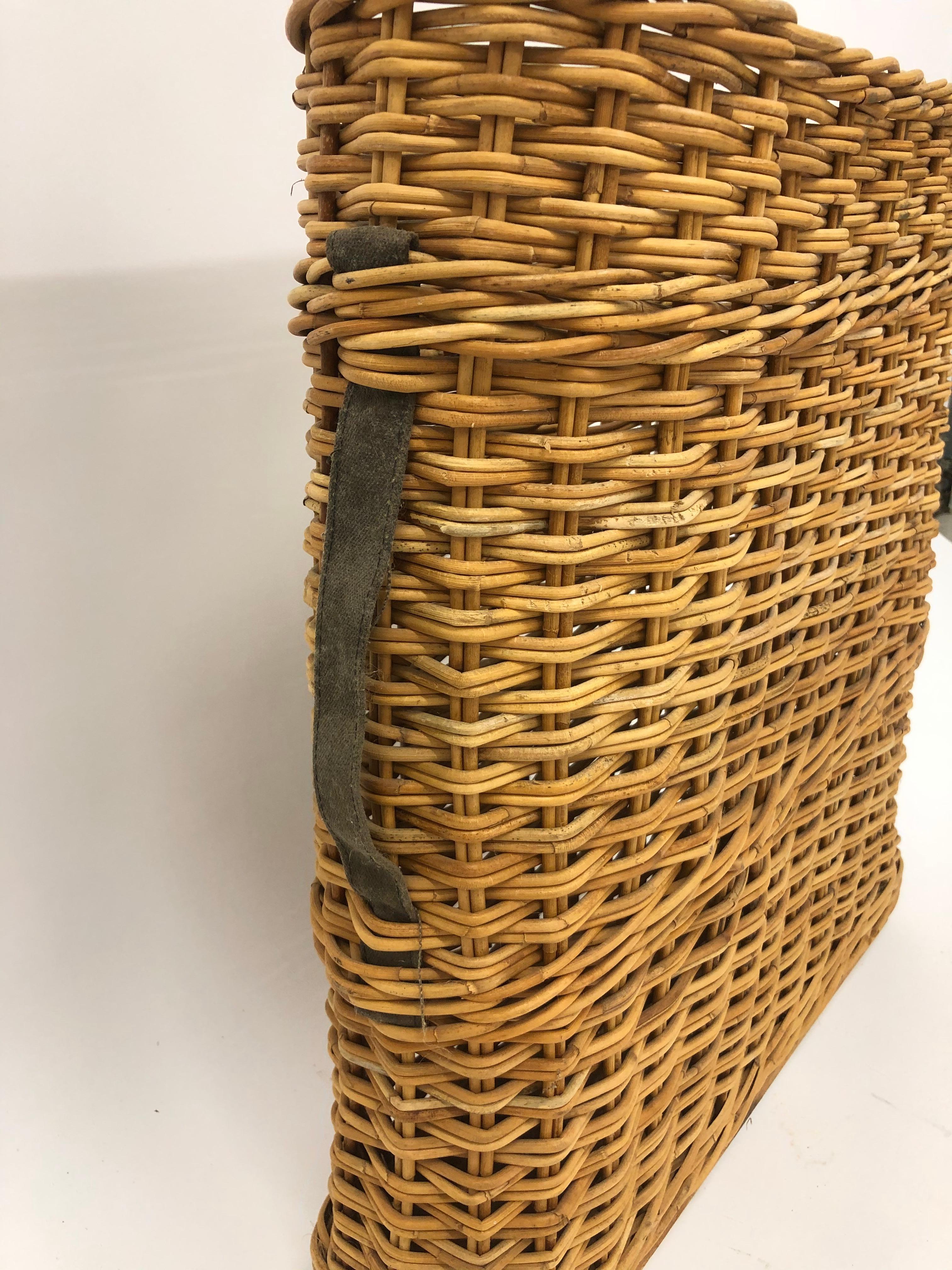 French basket for bottles with canvas straps.

Property from esteemed interior designer Juan Montoya. Juan Montoya is one of the most acclaimed and prolific interior designers in the world today. Juan Montoya was born and spent his early years in