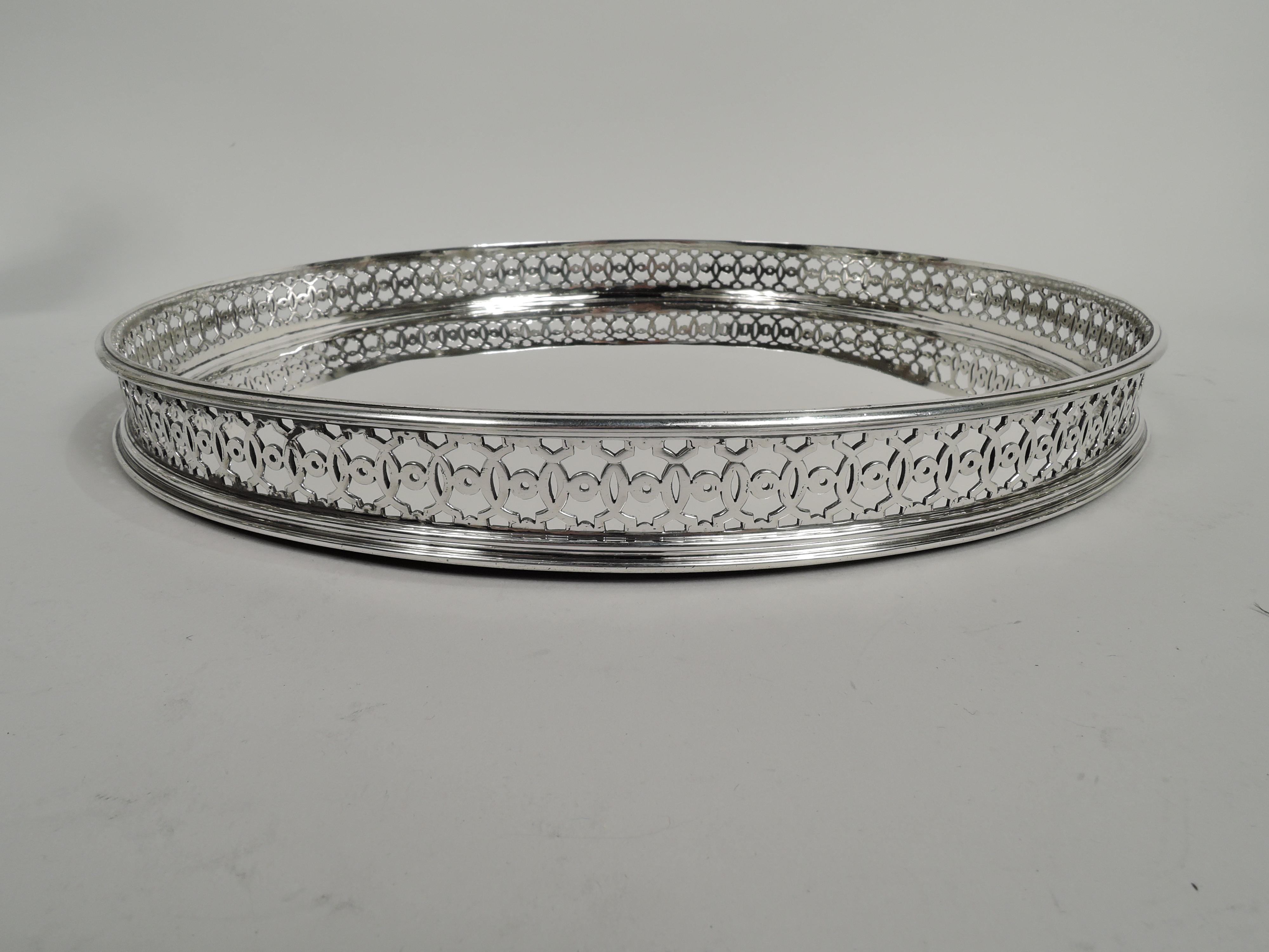 Belle Epoque Classical 950 silver tray. Made by Gustave Keller in Paris, ca 1910. Circular well and open gallery sides with interlaced circles joined by small circles. Fully marked including maker’s stamp. Weight: 30.7 troy ounces.