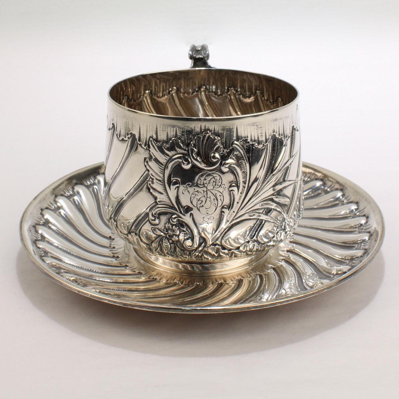 A very fine French sterling silver tea or coffee cup and saucer.

By the noted 19th century Parisian silver and goldsmith - Pierre Gavard.

With hand chased, swirled rib decoration throughout.

A central cartouche has an engraved monogram and is