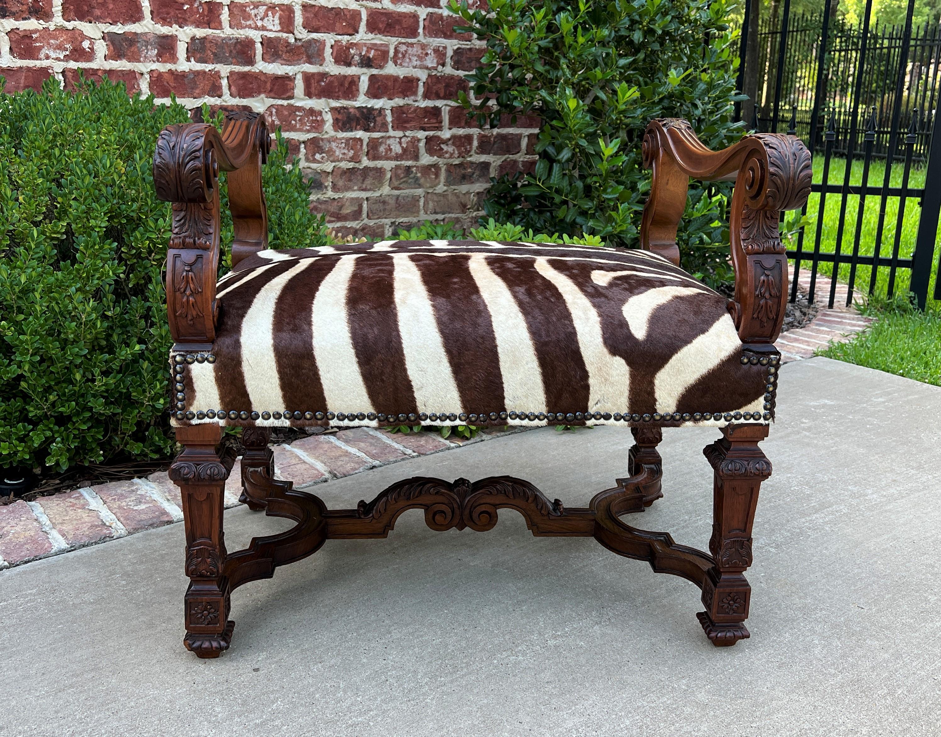 Charming Antique French Walnut Renaissance Revival Zebra Hide Bench or Chair~~HIGHLY CARVED with Scrolling Acanthus Arms, Bellflower Accents, Tapered Legs, and Stretcher~~c. 
1900s 


 Beautiful entry, foyer or hall bench for today's home~~or
