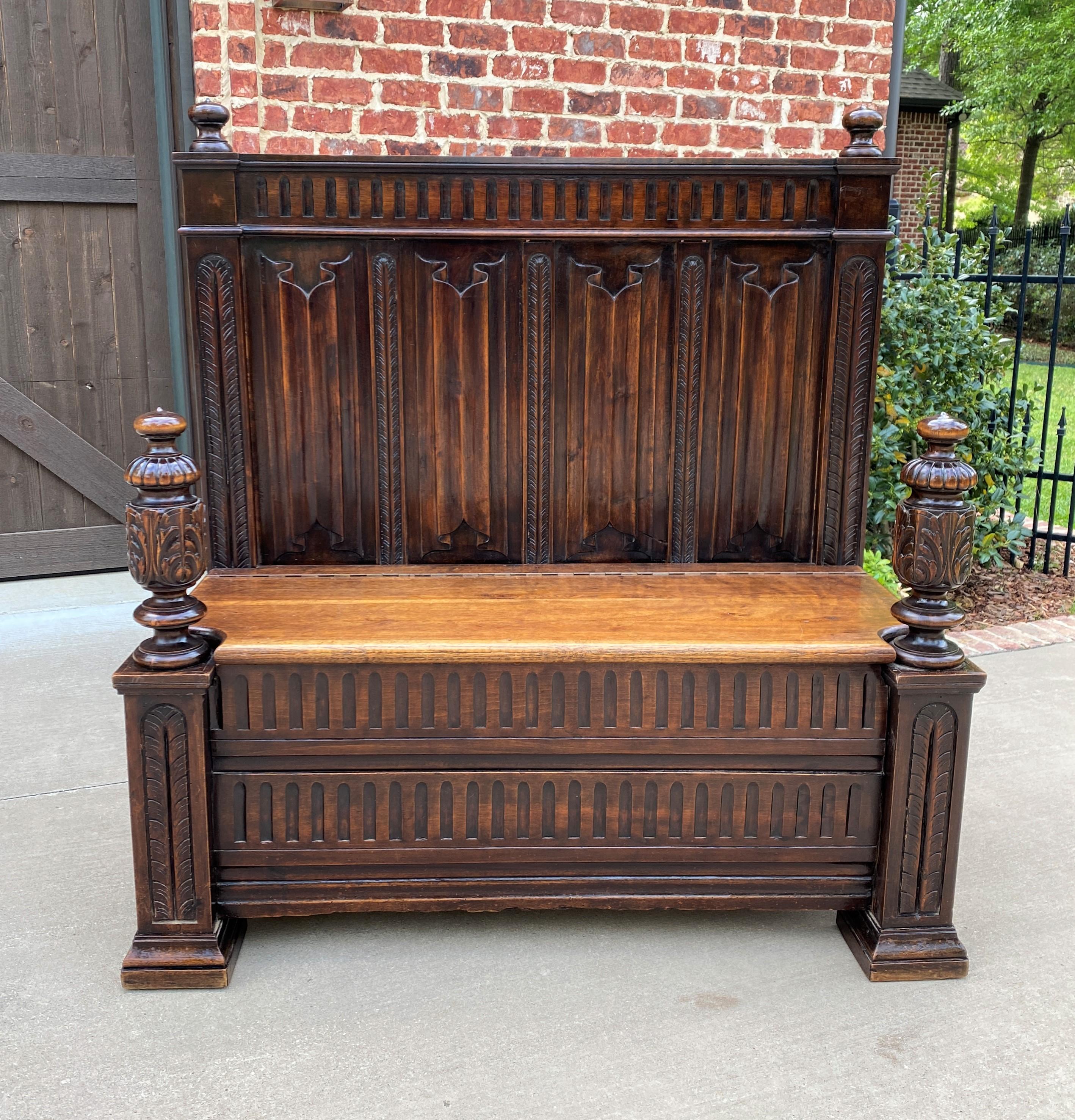 Beautiful antique French oak gothic revival bench or Settee with Lift-Top Seat and Storage~~HIGHLY CARVED ~~c. 
1880s 


 Spectacular design with cup and cover arms~~wonderful spoon carved frieze, sides and front panel with well defined linen
