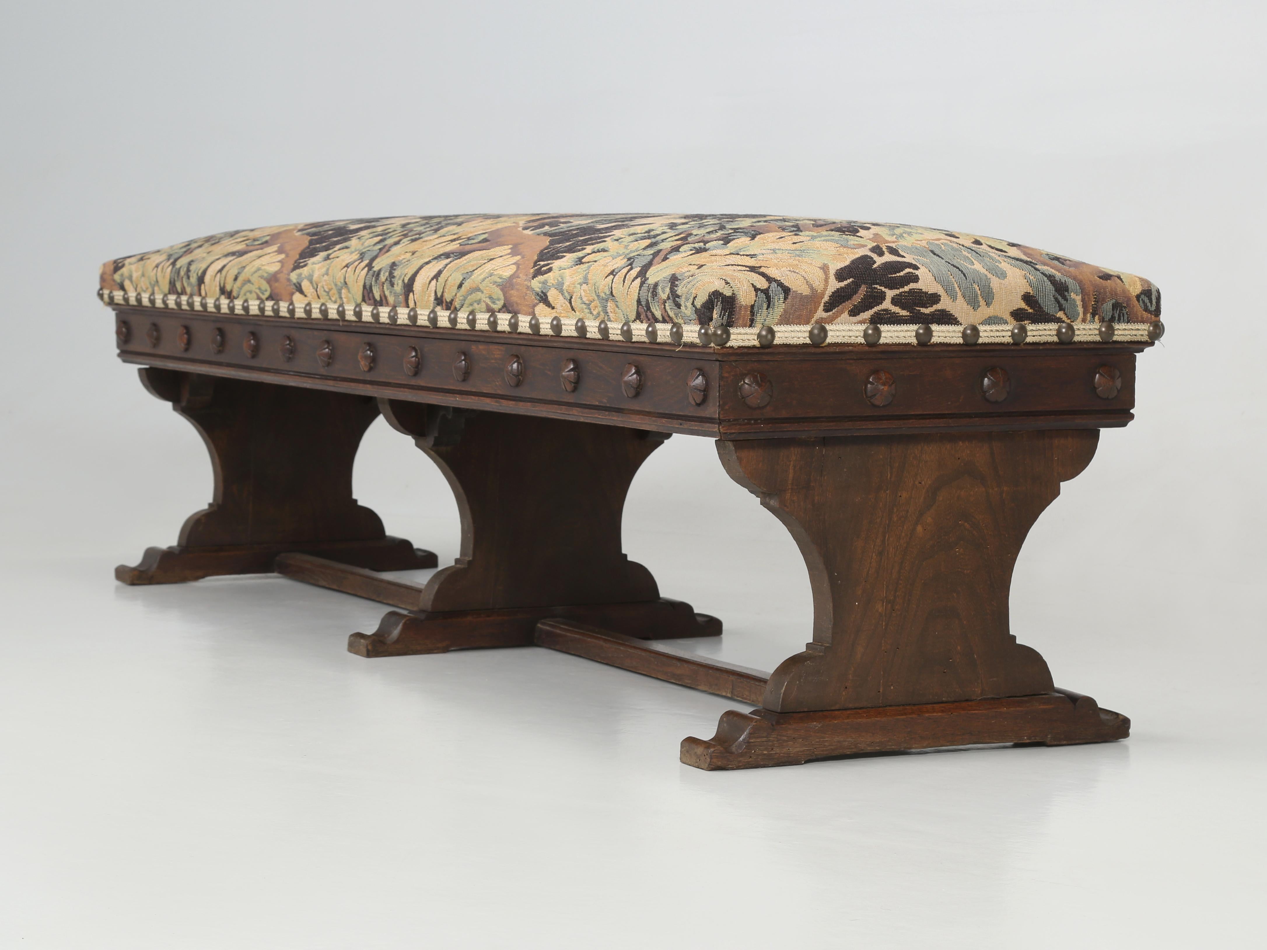 Antique French Upholstered Bench from the mid-1800s and appears to still be in its Original Finish and an Old fabric. Structurally sound and cosmetically original. This is one of a matching pair we have in stock and we are offering the Antique