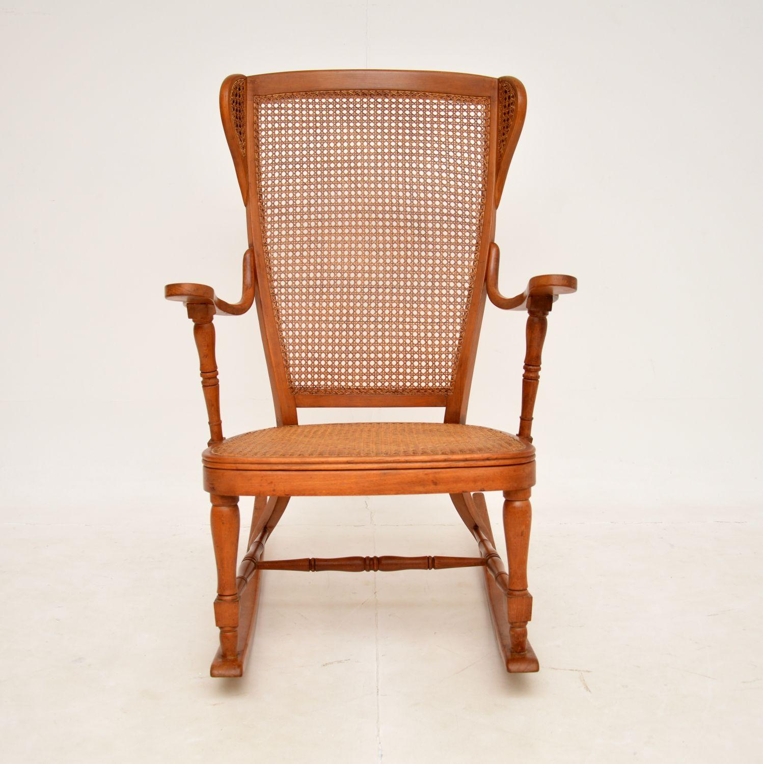 A lovely antique rocking chair, this was made in France and dates from around the 1900-1920 period.

It is beautifully made, the frame is a combination of turned and steam bent solid wood. The seat and back rest is caned, the back rest also has two