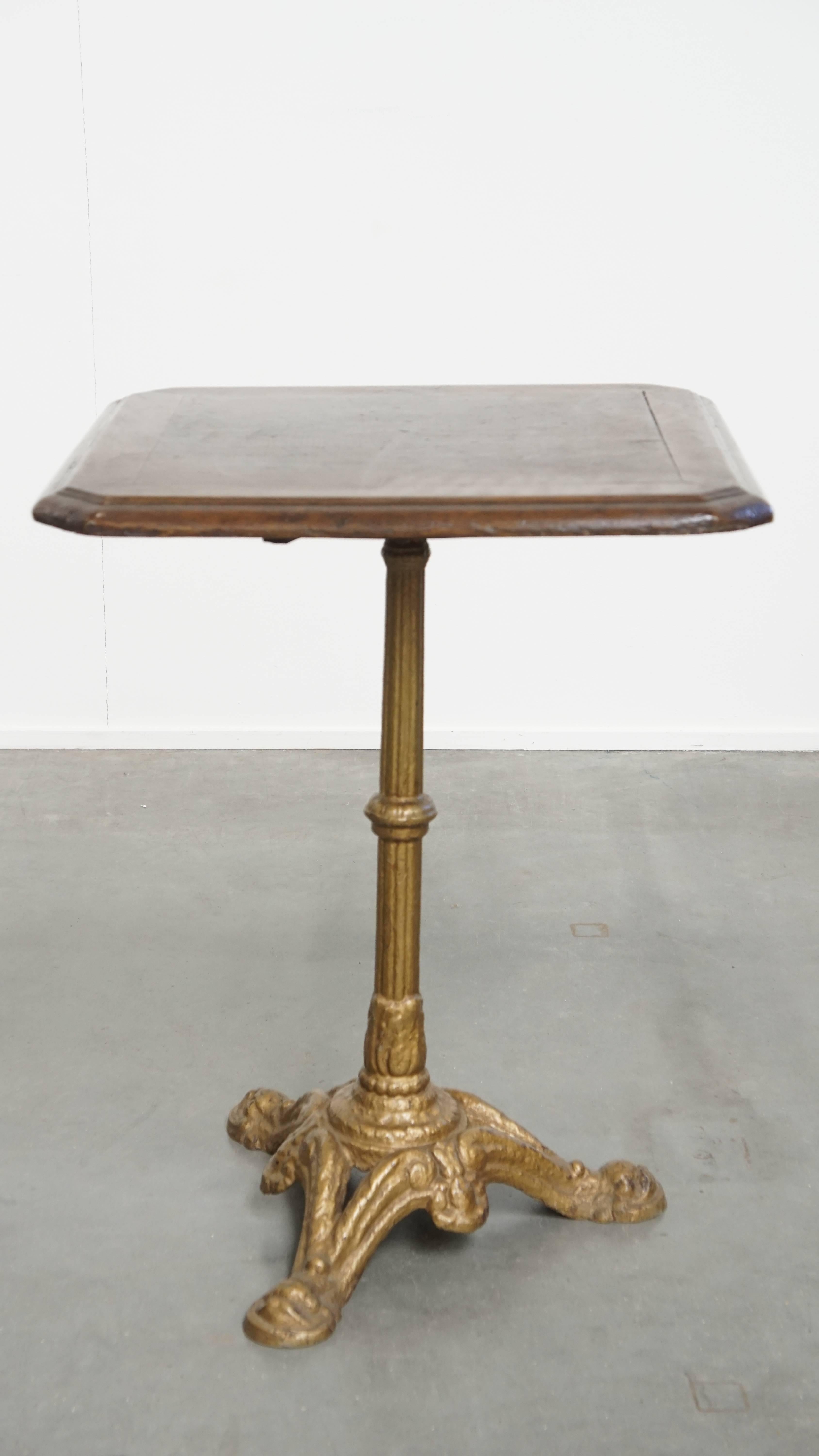 19th Century Antique French Bistro Table with Gold-Colored Cast Iron Base and Dark Oak Top For Sale