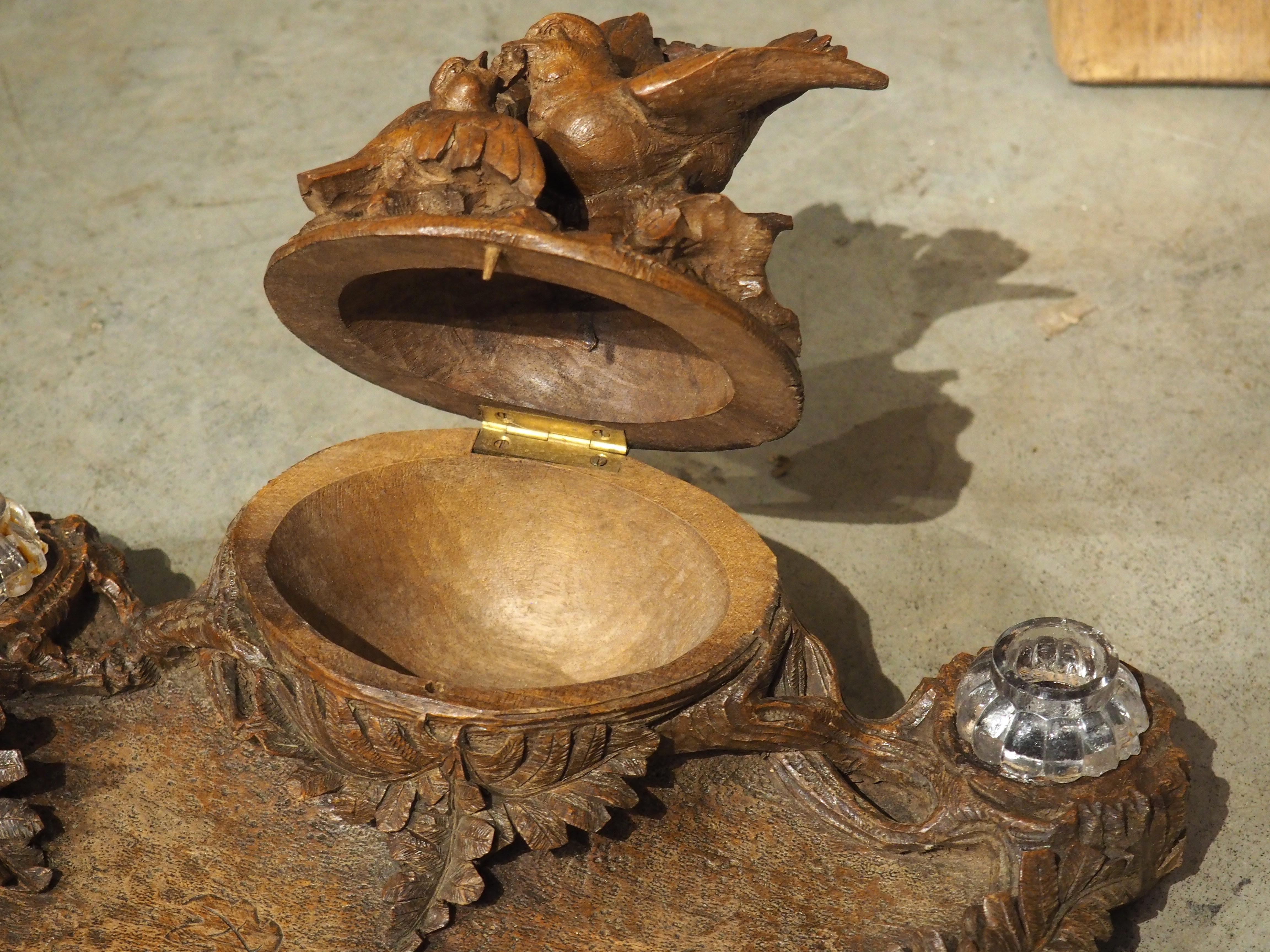 More information coming soon…

Hand-carved in France, circa 1890, this Black Forest inkwell is incredibly detailed with motifs of oak leaves and a pair of birds.  The two birds (a fledgling and an adult) are perched on a segment of an oak tree