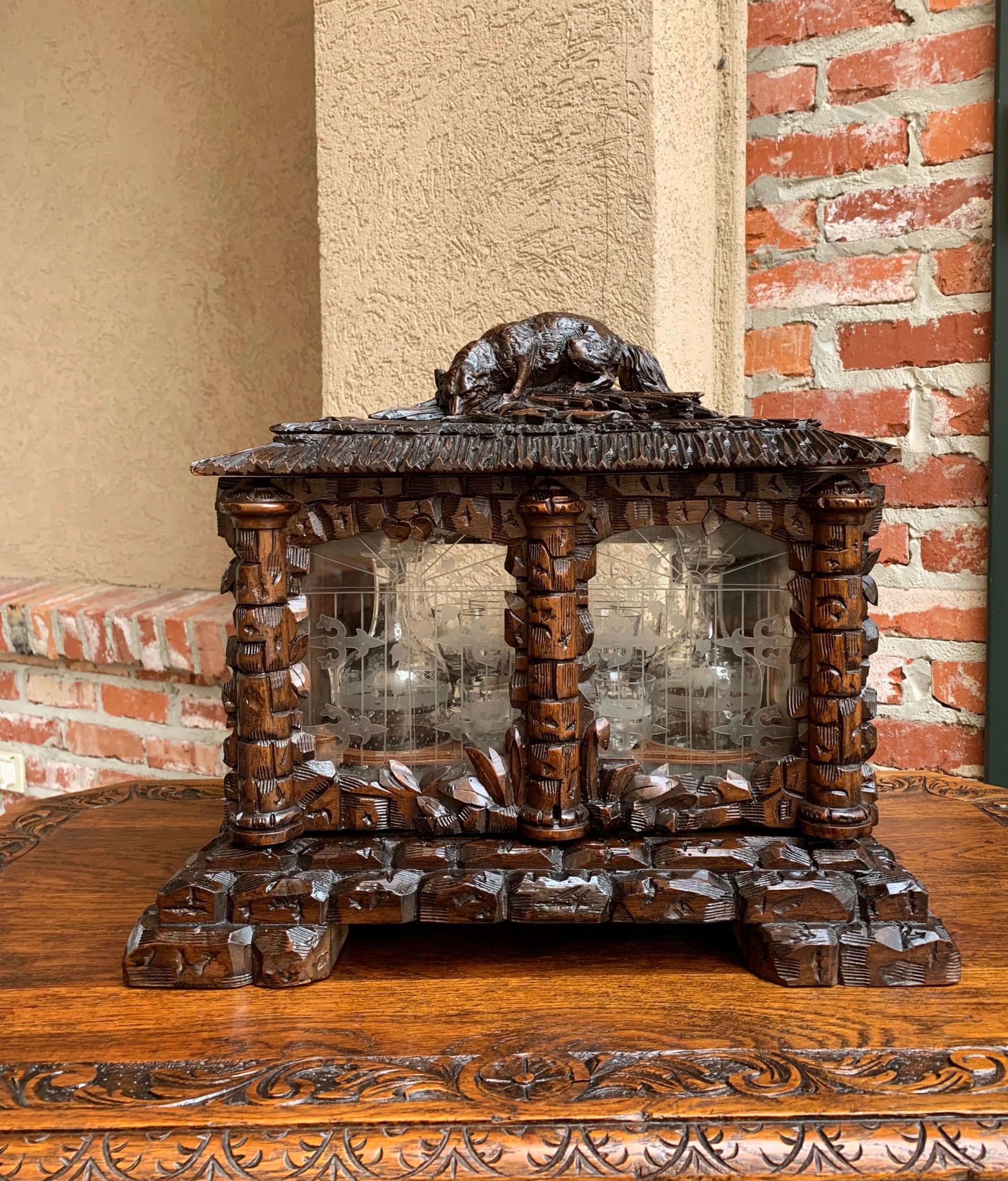 Antique French Black Forest Tantalus hunt dog liquor box decanter Cavé à Liqueur

~Direct from France~
~Stunning carved Black Forest tantalus or “cavé à Liqueur”!~
~The motif on the case is faux bois and stone (carvings emulate wood thatch roof