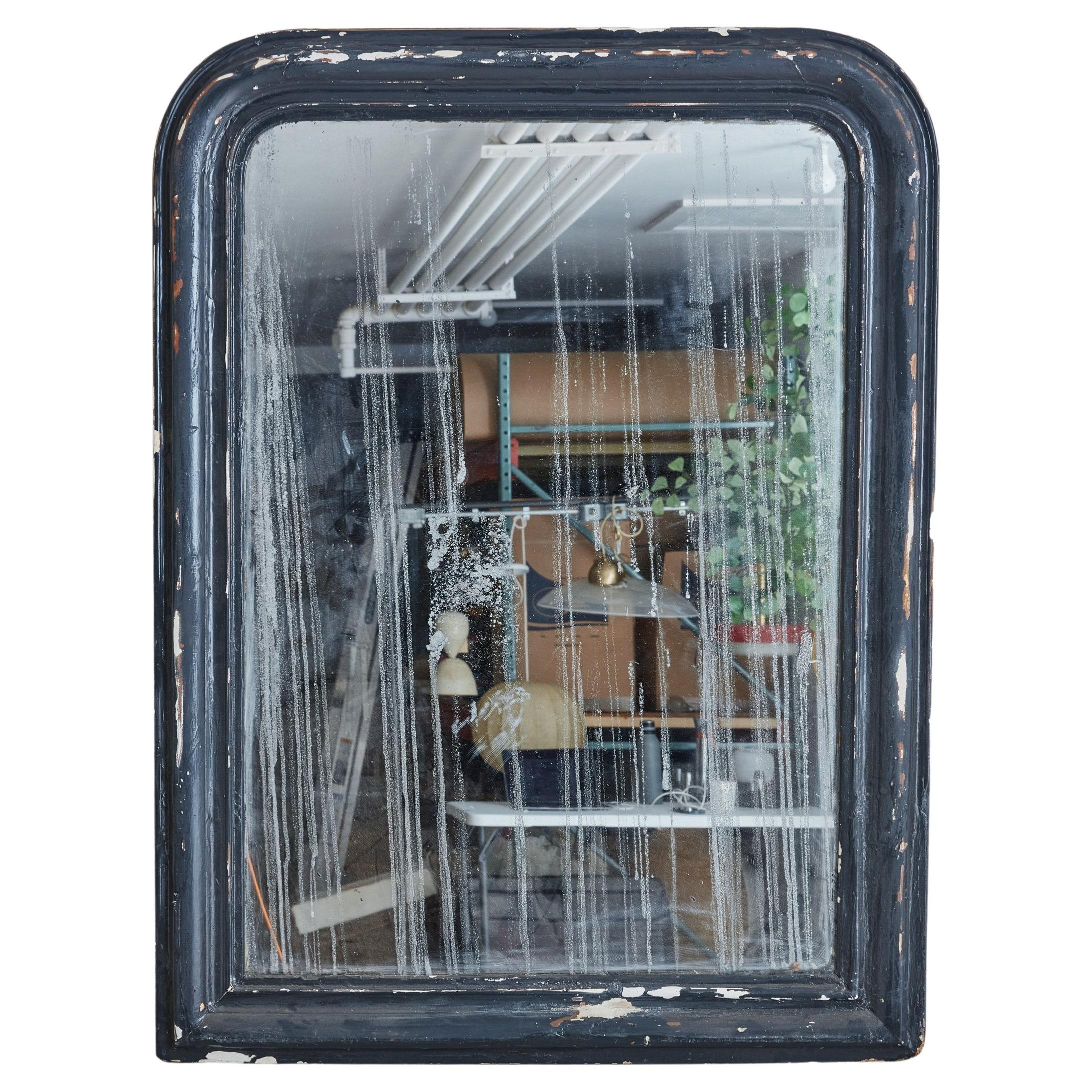 A gorgeous early 1900s antique mirror sourced in the South of France. Featuring a black wood frame + a heavily oxidized mirror, this is a piece that immediately brings depth to a space. 
 

DIMENSIONS: 36