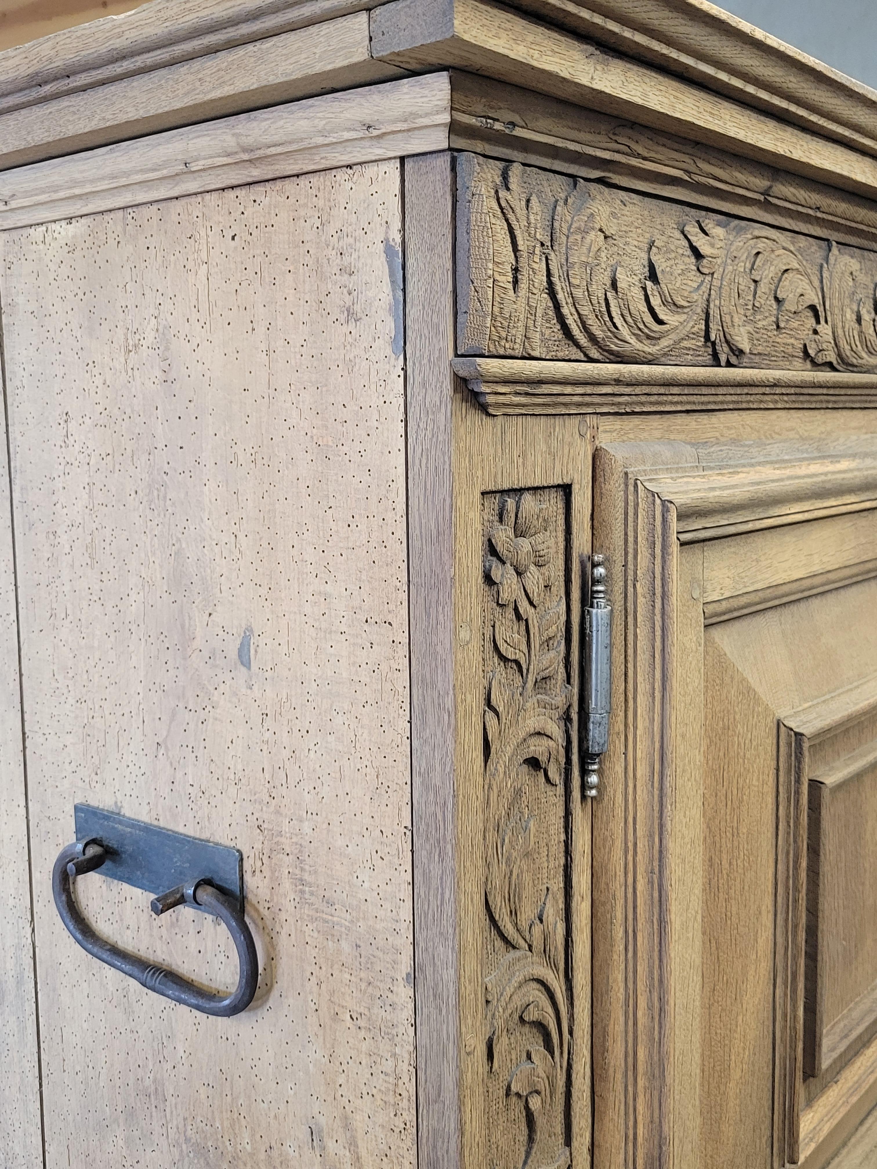 Antique French Bleached Oak and Pine Deux Corps Carved Cupboard In Good Condition In Centennial, CO