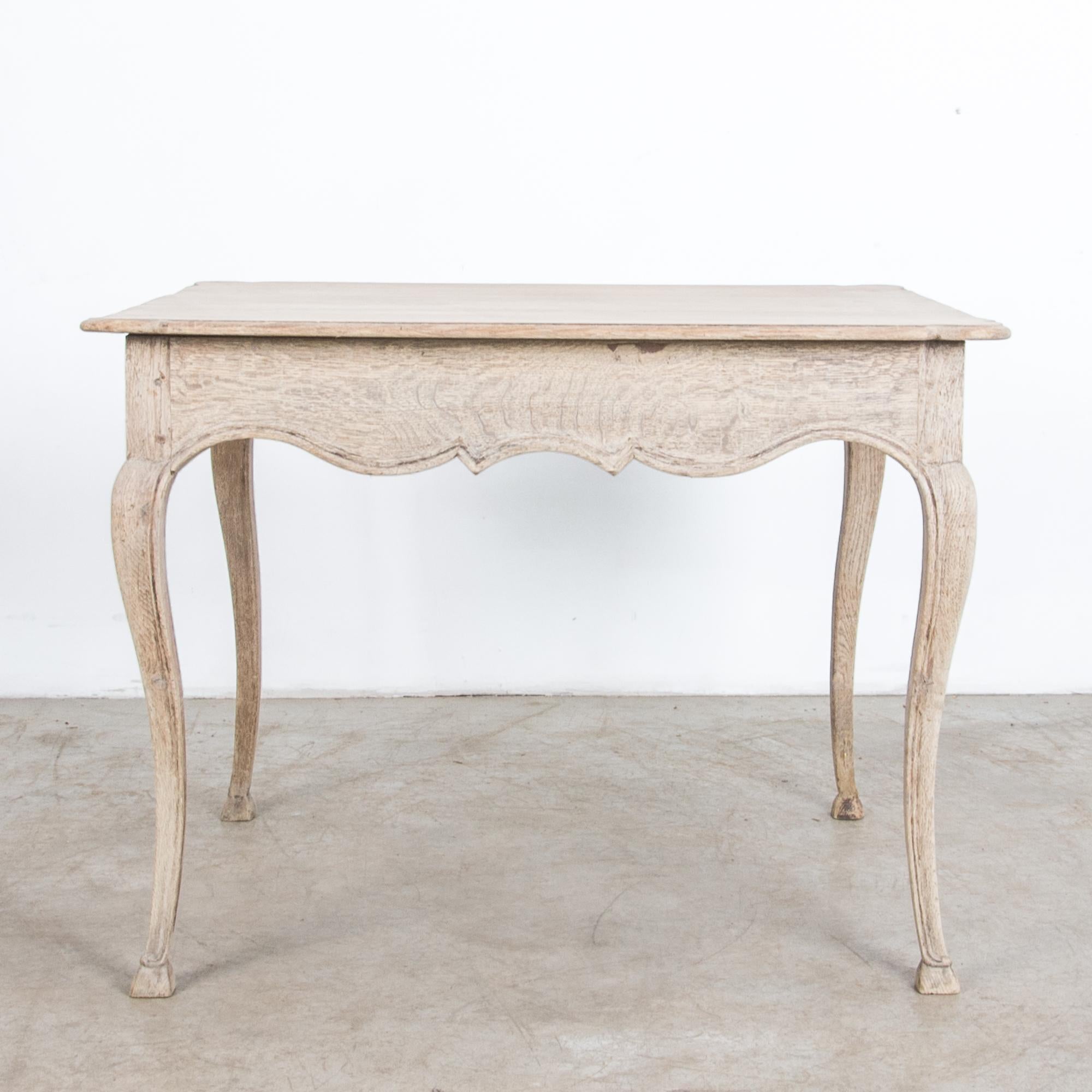 A simple and elegant oak table from France, circa 1880. Rustic yet refined, this oak table is crafted after the traditions of local craftsmen. Away from the capital, carpenters interpreted the latest fashion in pared down styles, recalling their