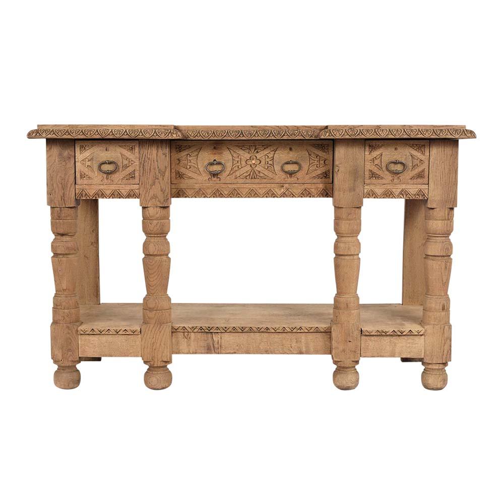 This French 19th century Baroque style sideboard is handcrafted and is made out of oak wood with a new bleached finish. It features a solid wooden top, with carved molding details around the edges, three drawers drawer with iron pulls & intricately