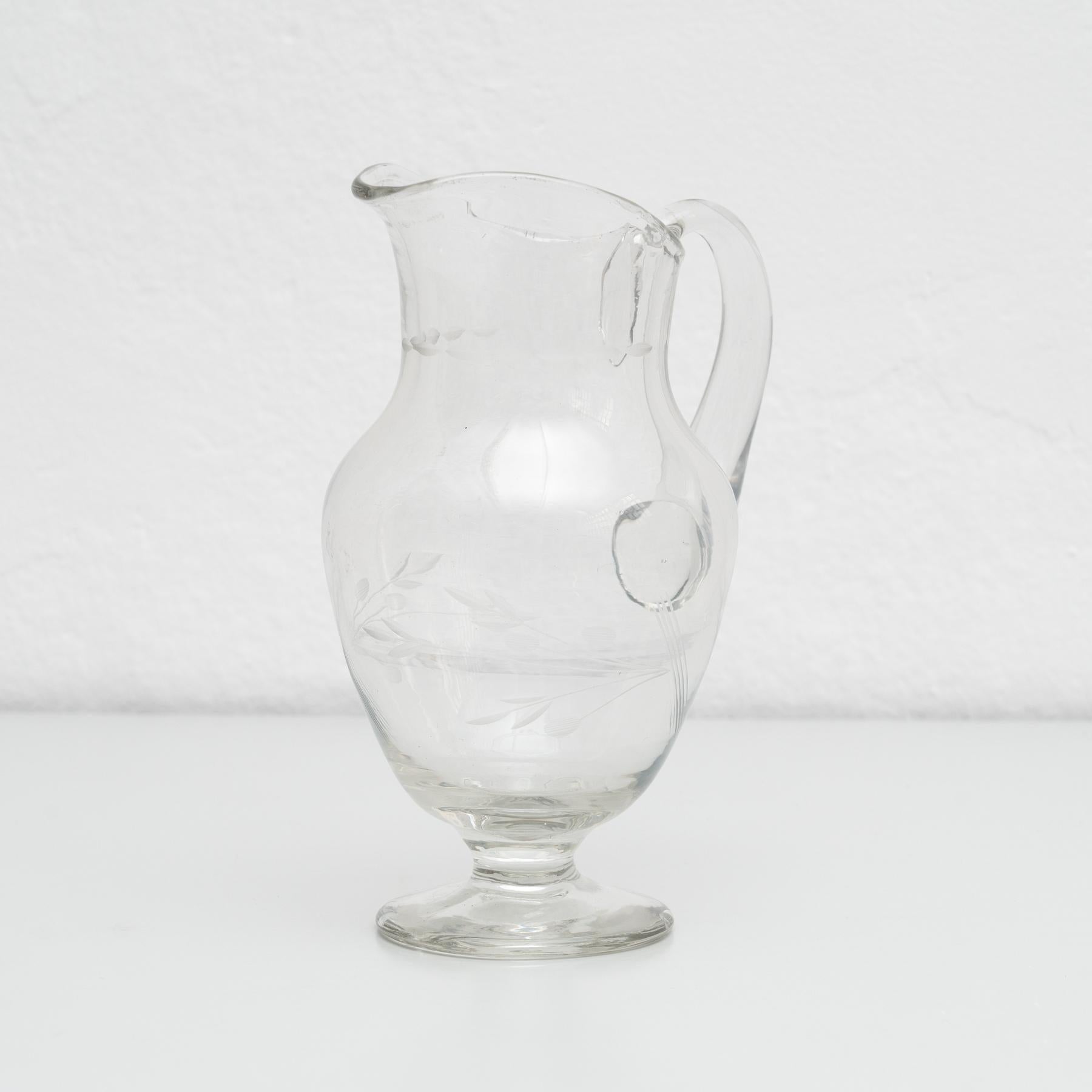 Blown glass water jar, circa 1950.    By unknown manufacturer, from France.    In original condition, with some visible signs of previous use and age, preserving a beautiful patina.    Materials:  Blown glass.    