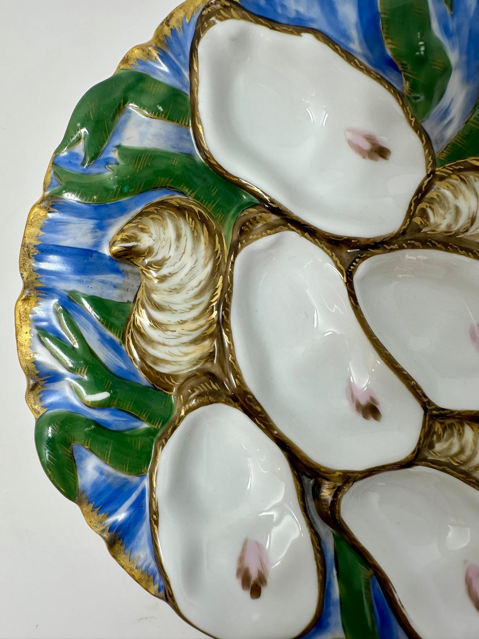 Antique French hand-painted porcelain turkey pattern oyster plate, circa 1890's.
Hand-Painted in blue, green and umber. Beautiful vivid coloring that is reminiscent of the presidential oyster plates.
