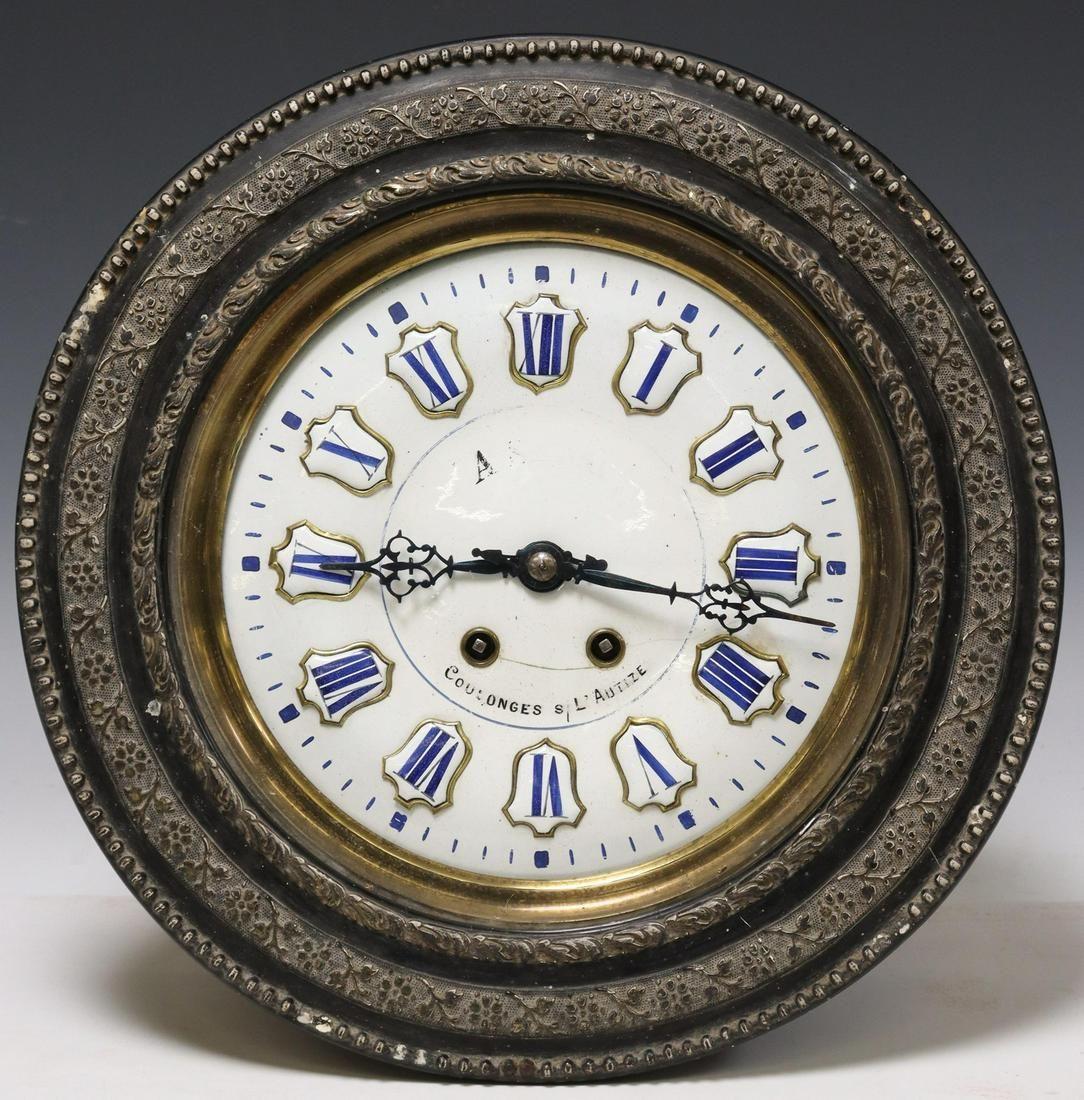 Antique French Blue and White Enamel wall clock, Napoleon III Period, late 19th c. The clock features an enamel dial with raised cartouches, Roman numeral hour markers, faint retailer inscription, time-and-strike movement, lacking pendulum, hairline