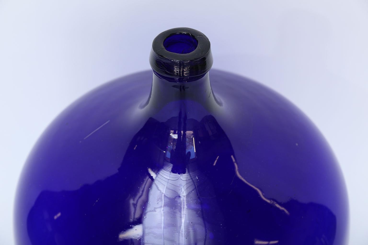 blue demijohn bottle