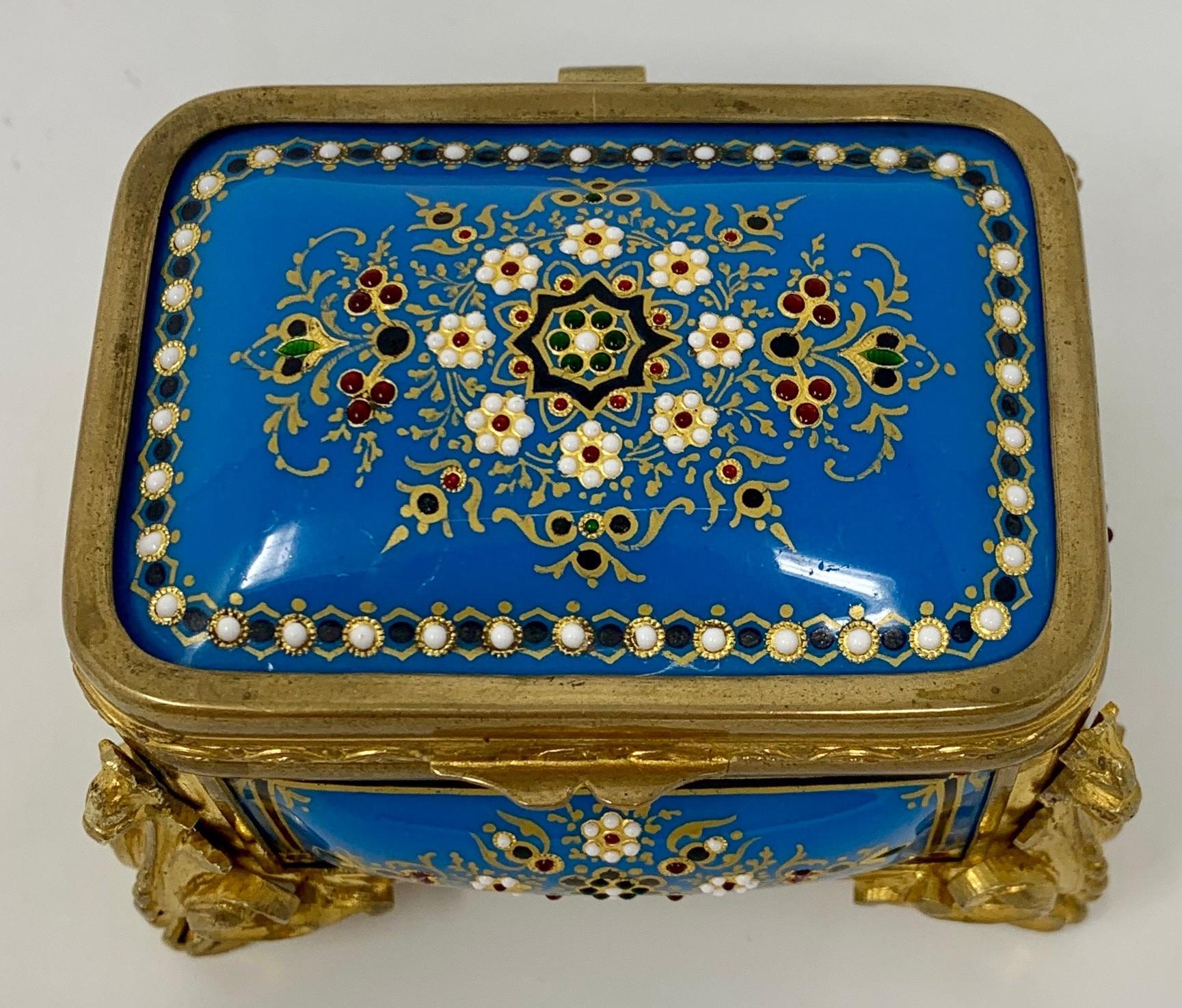 This is a very petite little jewel of an enameled box. The interior fabric has not been replaced. The ormolu and enameling is finely rendered.