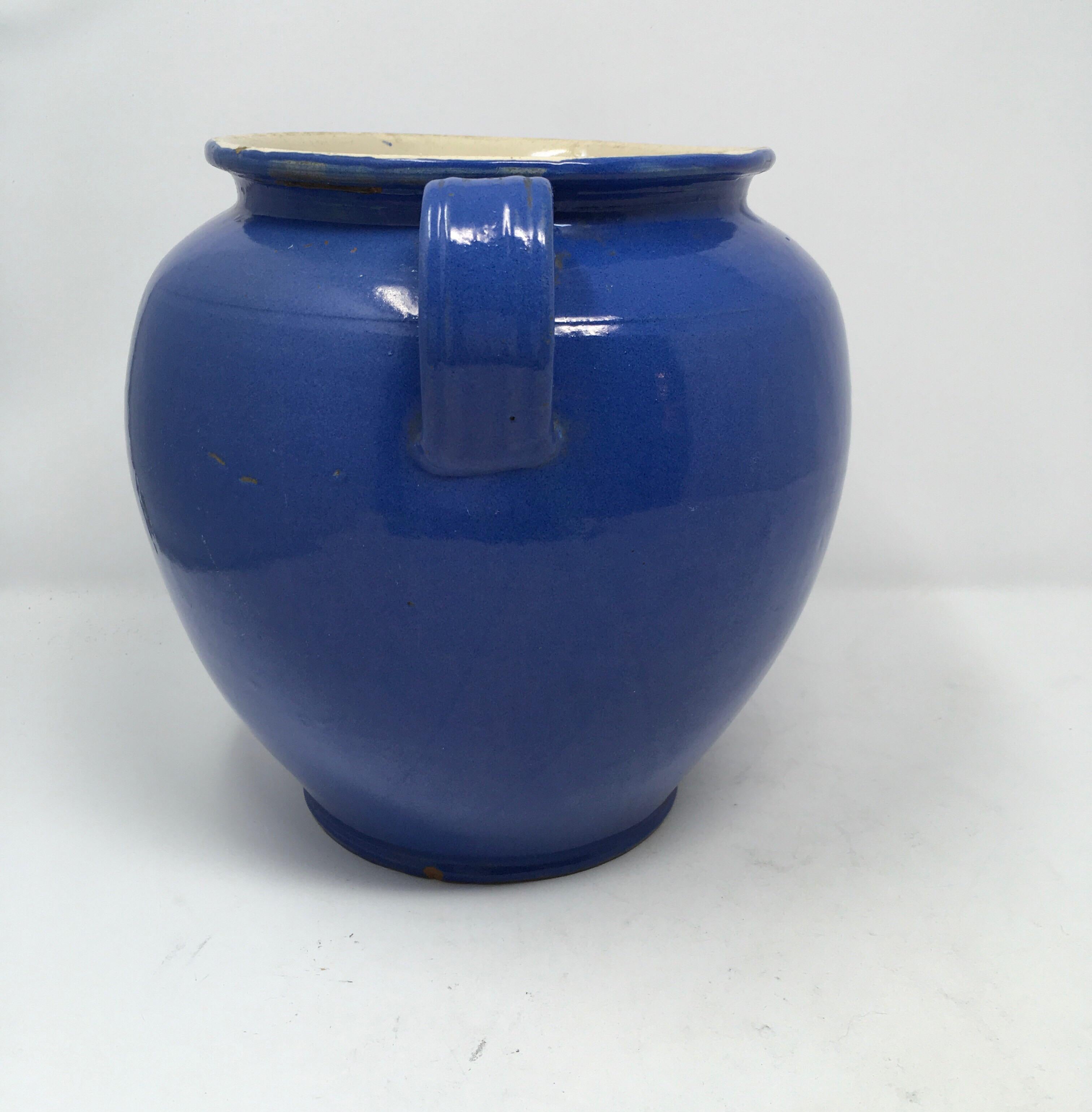 Found in the South of France, this antique French blue confit Pot is from the 19th century. Covered in a blue glaze, pots like this were a staple in every French kitchen for preserving. From the South West of France, it has two small handles on each