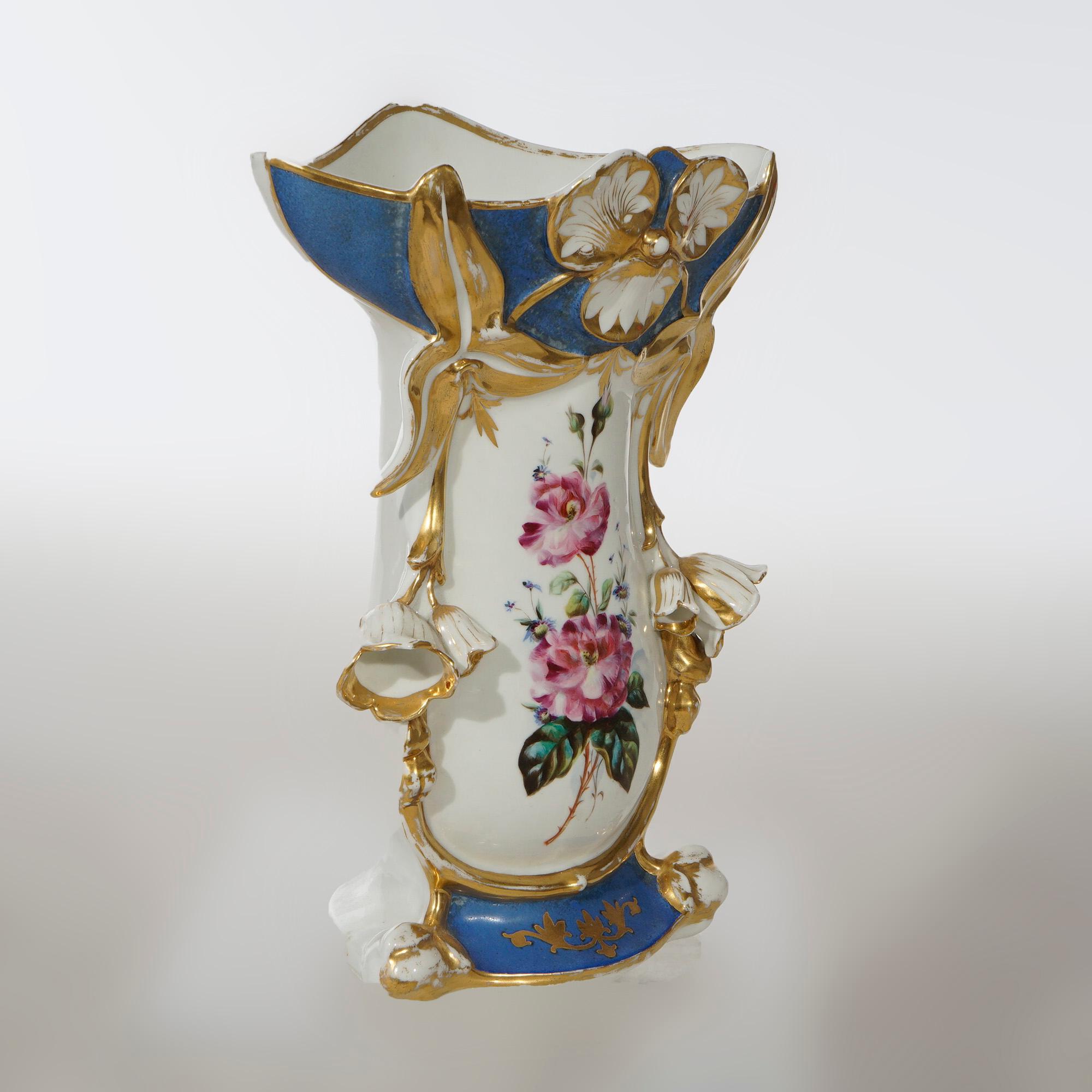 An antique French Old Paris vase offers porcelain footed construction with hand painted blue floral reserve on blue ground with gilt highlights throughout, 19th century

Measures- 13'' H x 9.75'' W x 5.25'' D.