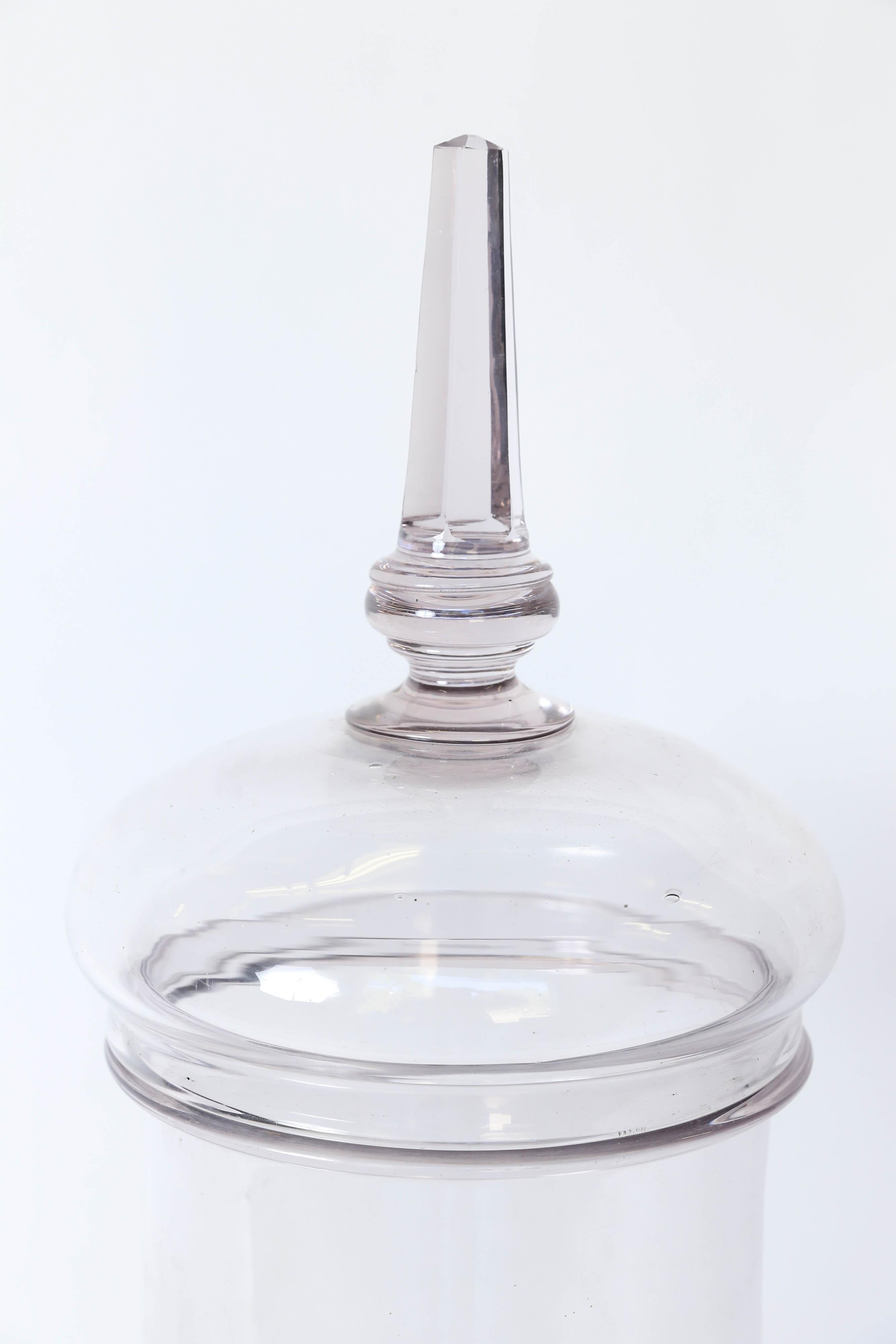 Beautiful glass French bon bon jar with a lavender tint. These jars were used in France either in confiserie shops to display candy or pharmacies to display medicinal products. A lovely addition to your home.