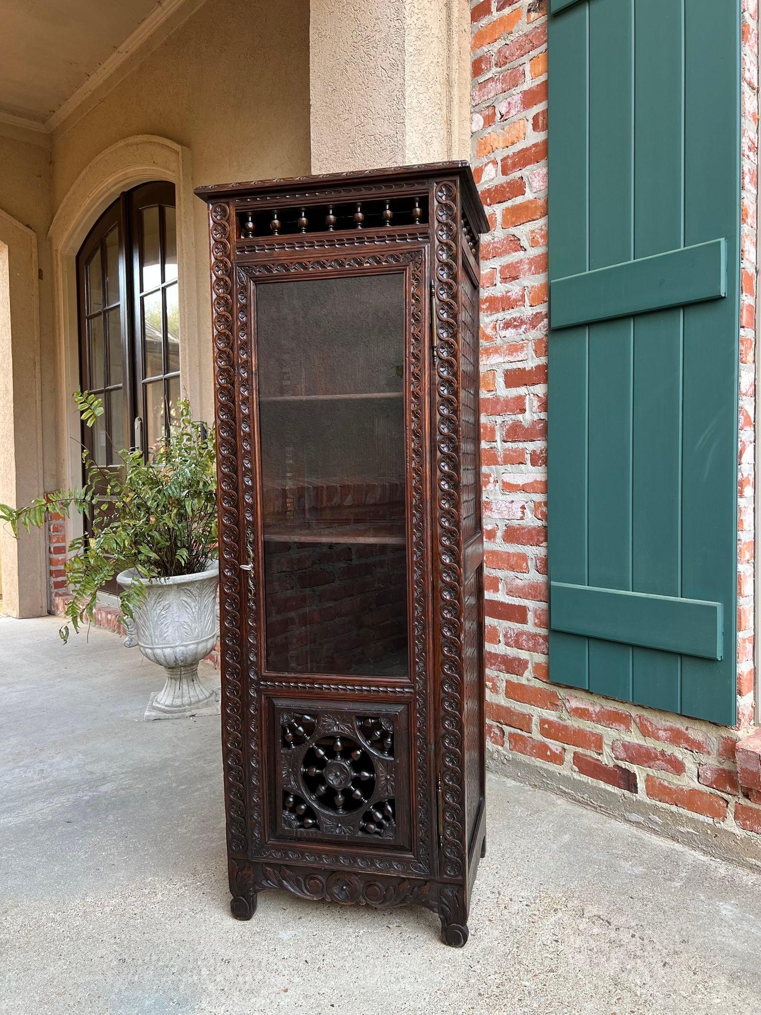 Antique French Bookcase Cabinet Brittany Breton PETITE Carved Oak Ship Spindle.

Direct from the Brittany region of France, another beautiful antique bookcase or cabinet, with gorgeous hand carvings throughout.
This cabinet’s tall, yet petite and