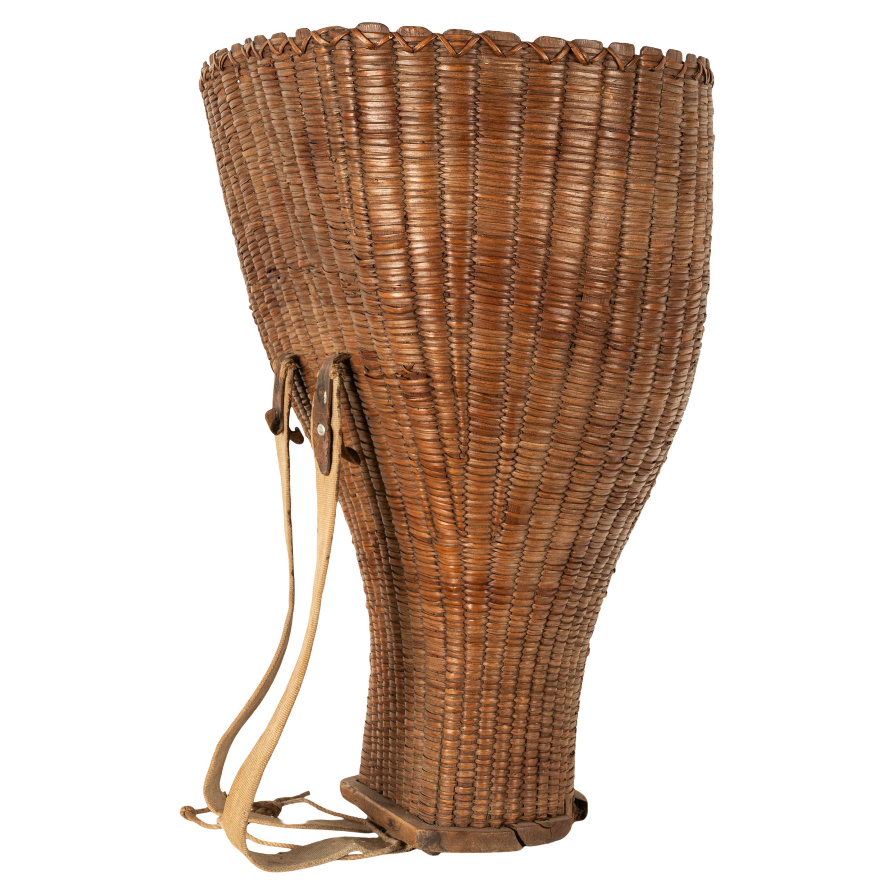A large, rare & unusual antique 19th Century French grape picking basket from Chateau  Margaux, Bordeaux, France, circa 1870.
This very large 19th century French footed vineyard basket used for harvesting grapes, with leather straps for carrying.