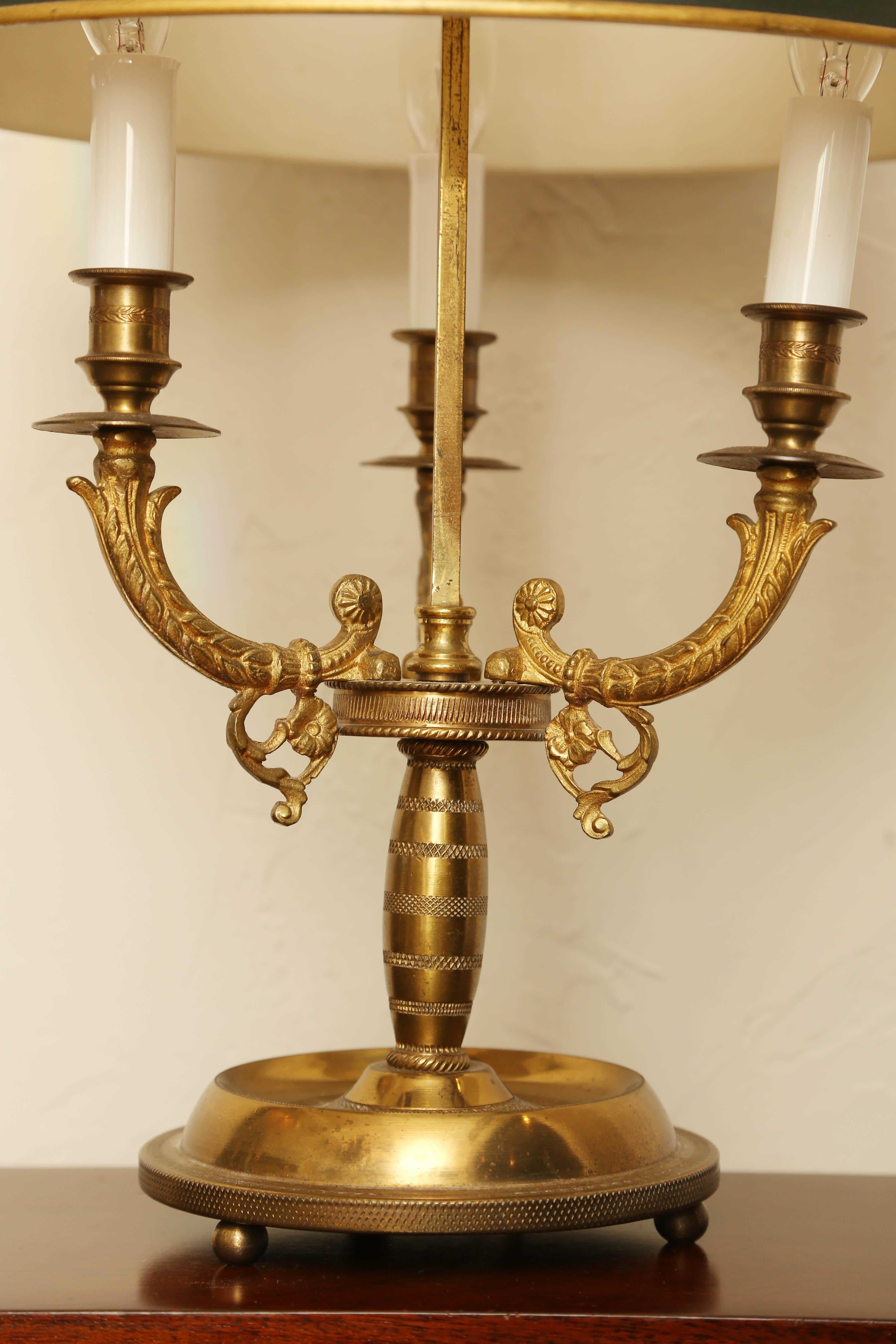 Lovely antique French Bouillotte lamp with hunter green and gold tole shade.
 