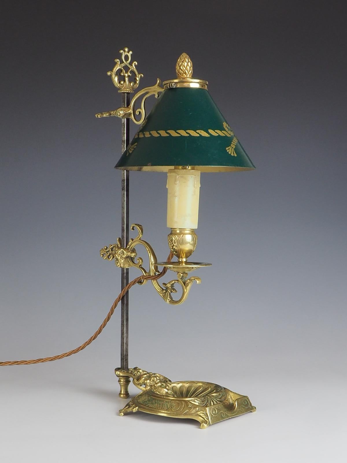 Antique French Bouilloute Candlestick Table Lamp is a stunning piece that exudes elegance and charm. Crafted from antique brass, this lamp showcases a traditional bouilloute design with a single light. The highlight of this lamp is its adjustable