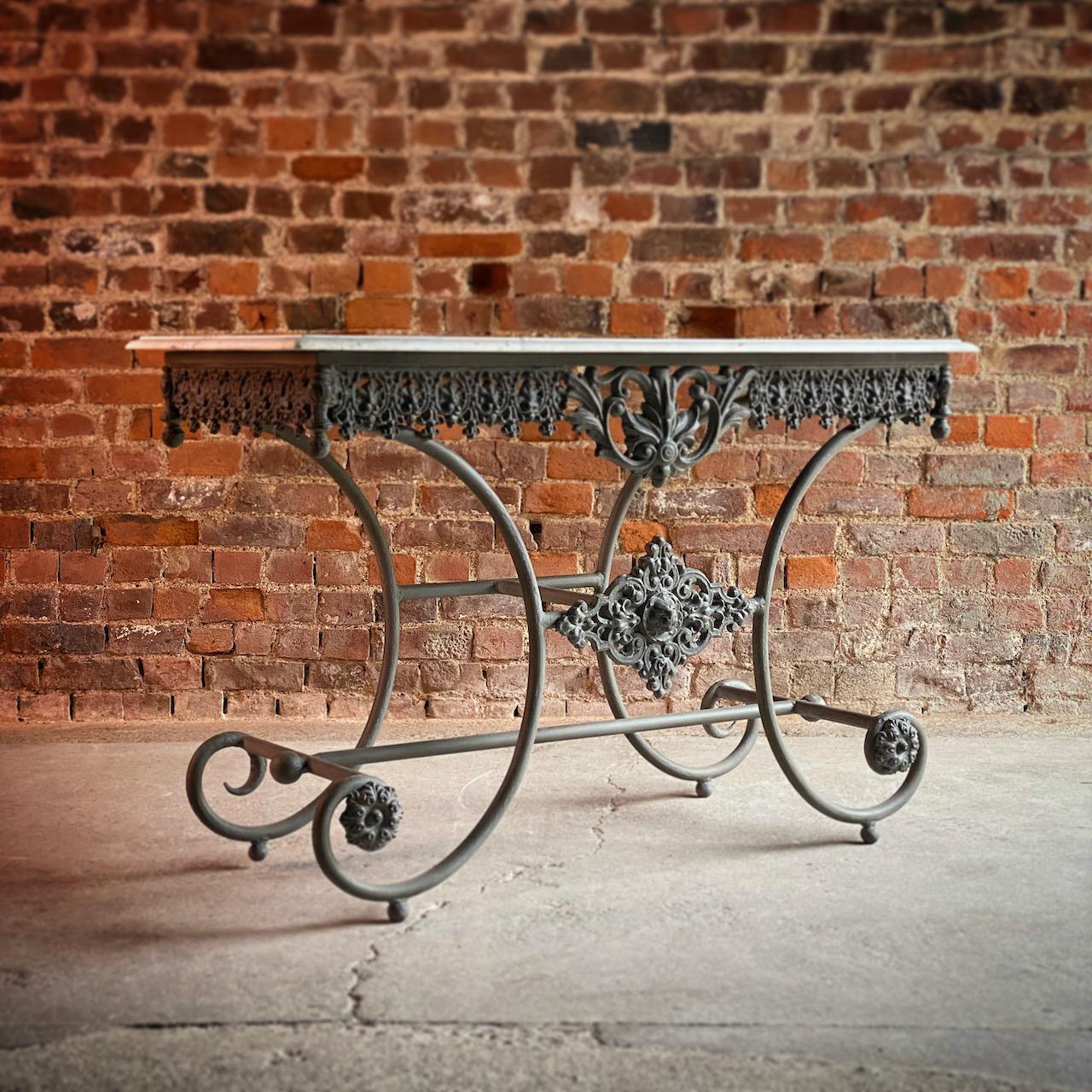 Antique French Boulangerie pastry table France circa 1890 

Magnificent and original 19th century French Boulangerie Pastry table dating to France circa 1890, the rectangular white marble top over a scrolling wrought iron base with beautiful