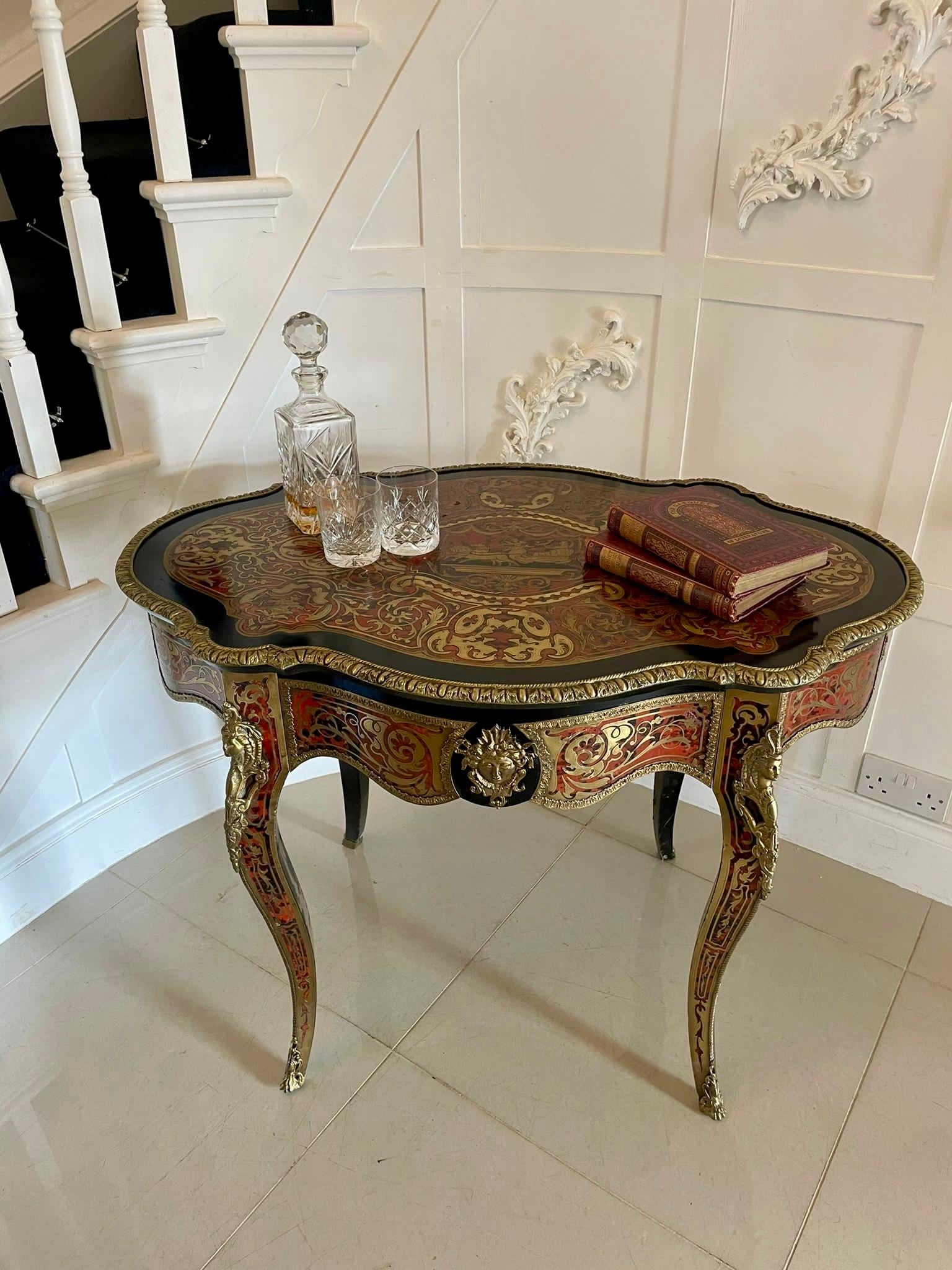 Antique French Boulle Centre Table having a fabulous serpentine shaped top featuring all over tortoise shell and profuse inlaid brass decoration, quality gilt bronze mounts and a single drawer standing on elegantly  shaped legs with brass inlay and