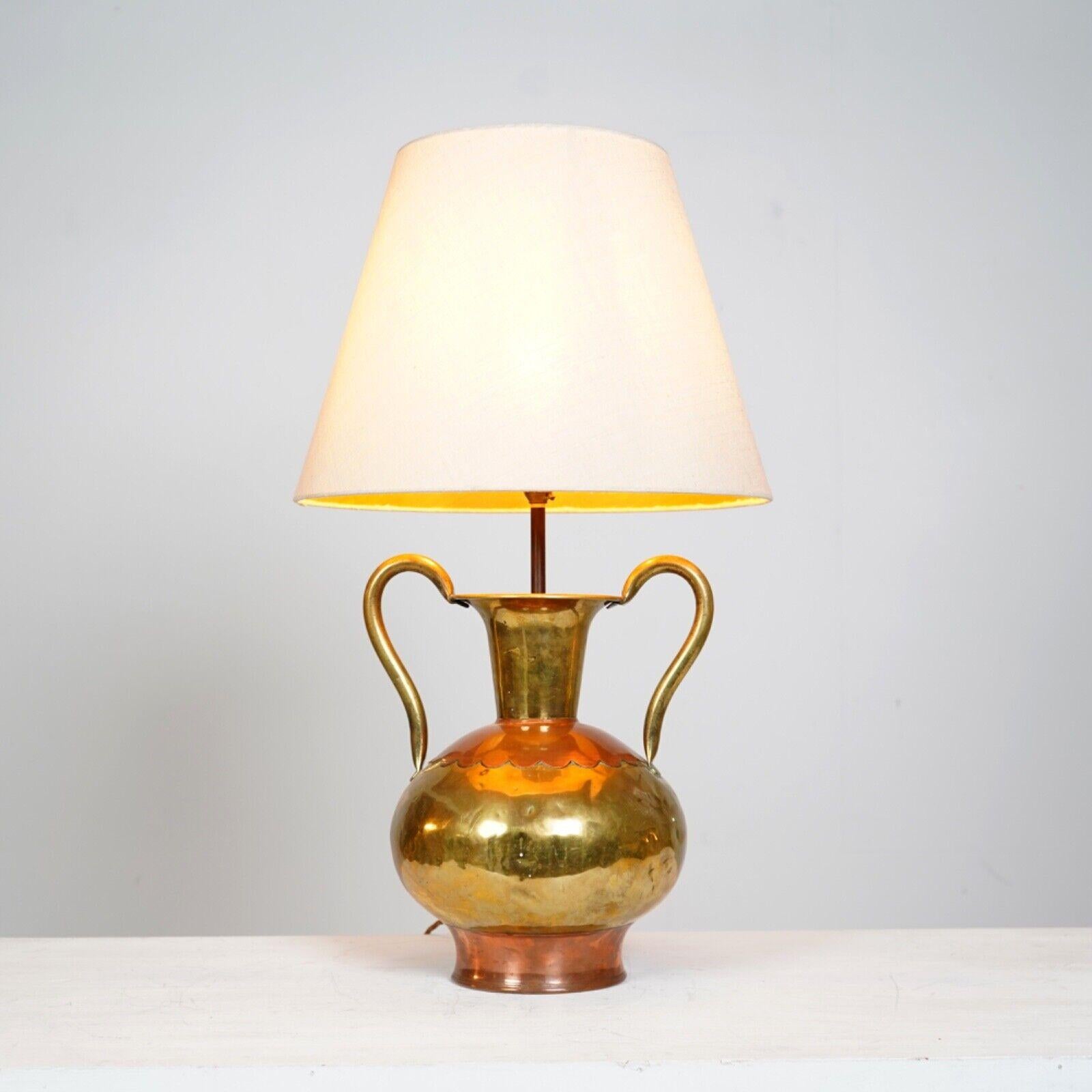 French Villedieu Copper Lamp. 
Double handed urn like vase thought to have been made in Villedieu, a town in southern France renowned for its talented copper artists. 
Later converted to a lamp. 
PAT tested. 
Shade not included.
 
Dimensions
 
H