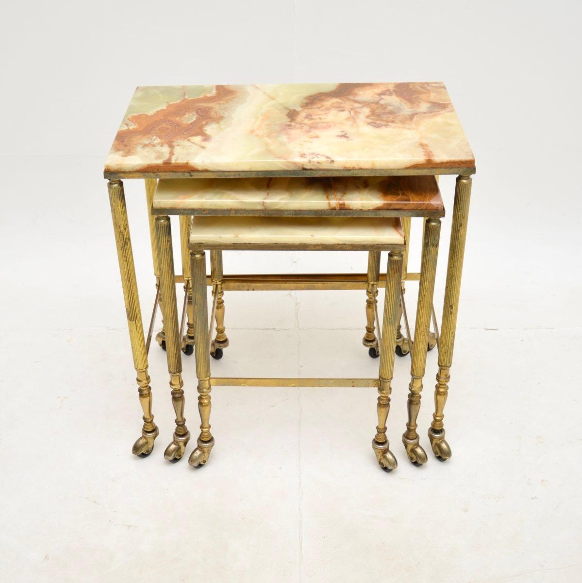 A beautiful antique French brass and onyx nest of tables, dating from around the 1930’s.

They are of superb quality, the solid brass frames have fluted legs, stretchered bases and sit on brass casters. The inset onyx tops are removable, they have