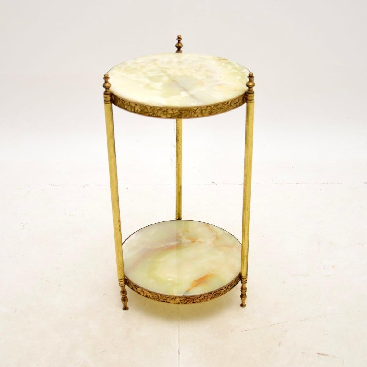 A beautiful antique French brass and onyx side table. This was made in France, it dates from around the 1930’s.

The quality is superb, the brass frame has fine and intricate details around the edges, it stands on fluted legs with finials at the