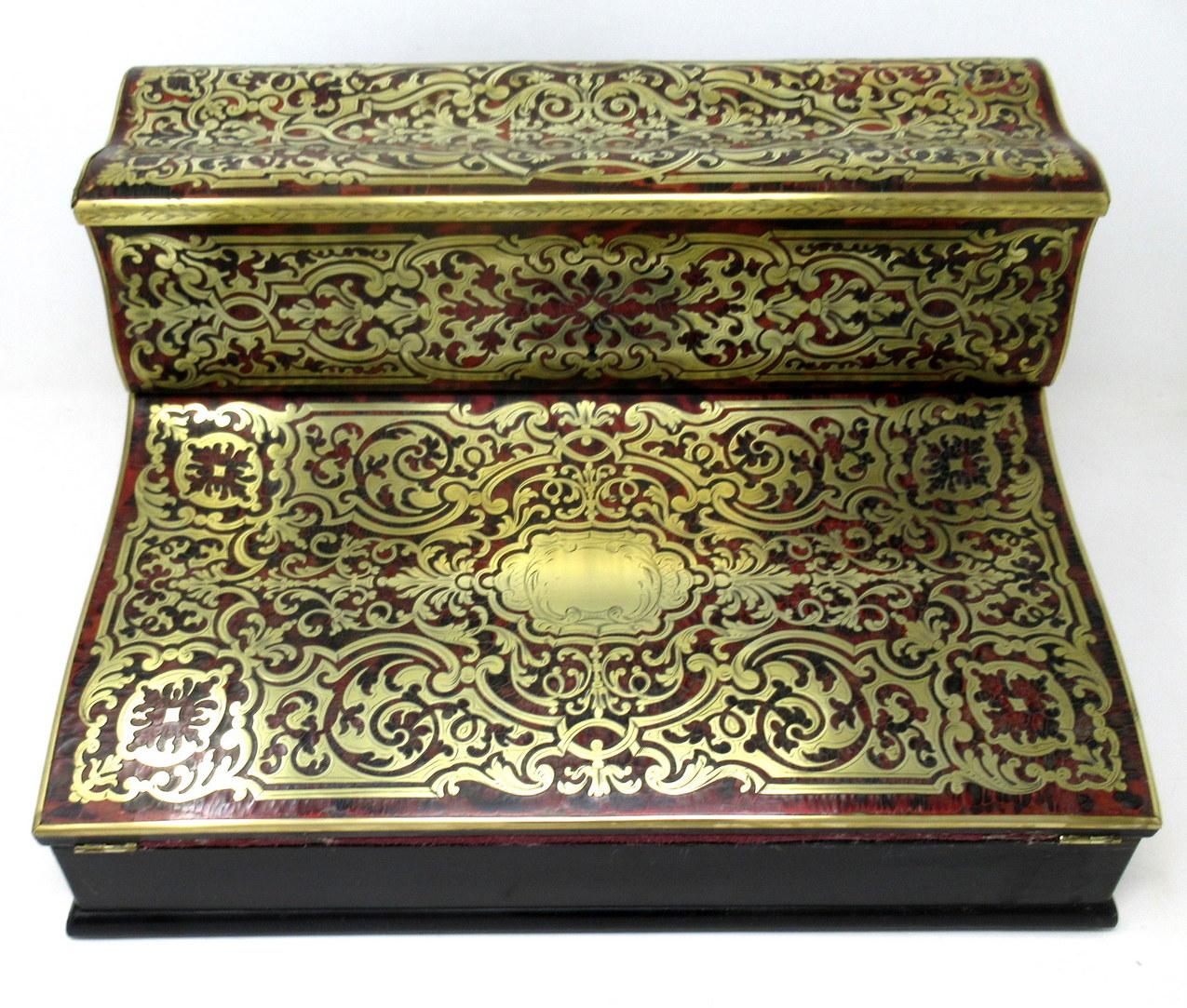 An exceptionally fine quality example of a polished brass, ebony and shell inlaid boulle style travelling writing slope made during the first half of the nineteenth century, of French origin. 

The entire top area decorated with premier and