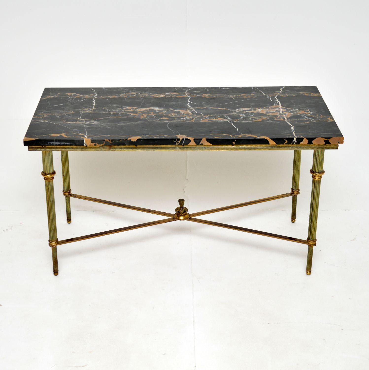 A stunning vintage French coffee table in solid brass and marble. This was made in France, it dates from around the 1930-50’s.

The quality is outstanding, this is one of the finest we’ve had. There are intricate brass details around the legs and
