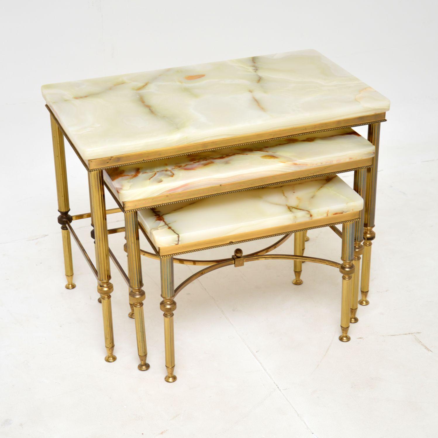 A stunning and extremely well made vintage nest of tables in solid brass with onyx tops. They were made in France, and date from around the 1950’s.

The quality is outstanding, the onyx tops have a beautiful colour tone and are attached to the brass