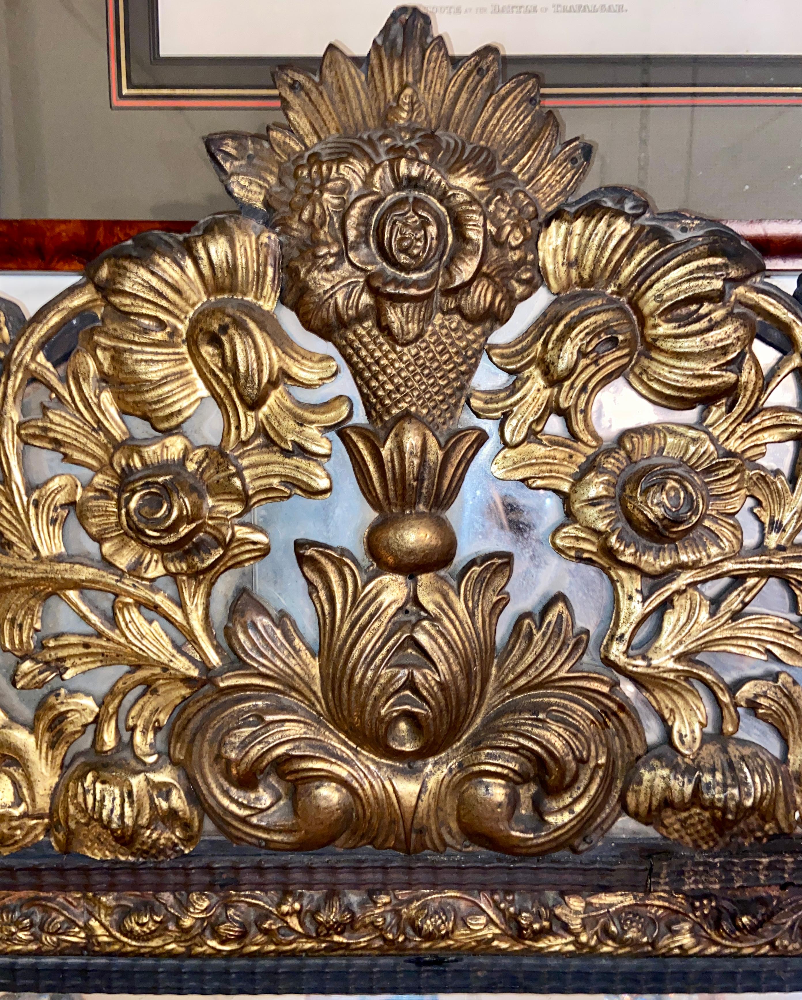 Antique French brass Repoussé paneled mirror with beveling, circa 1860.