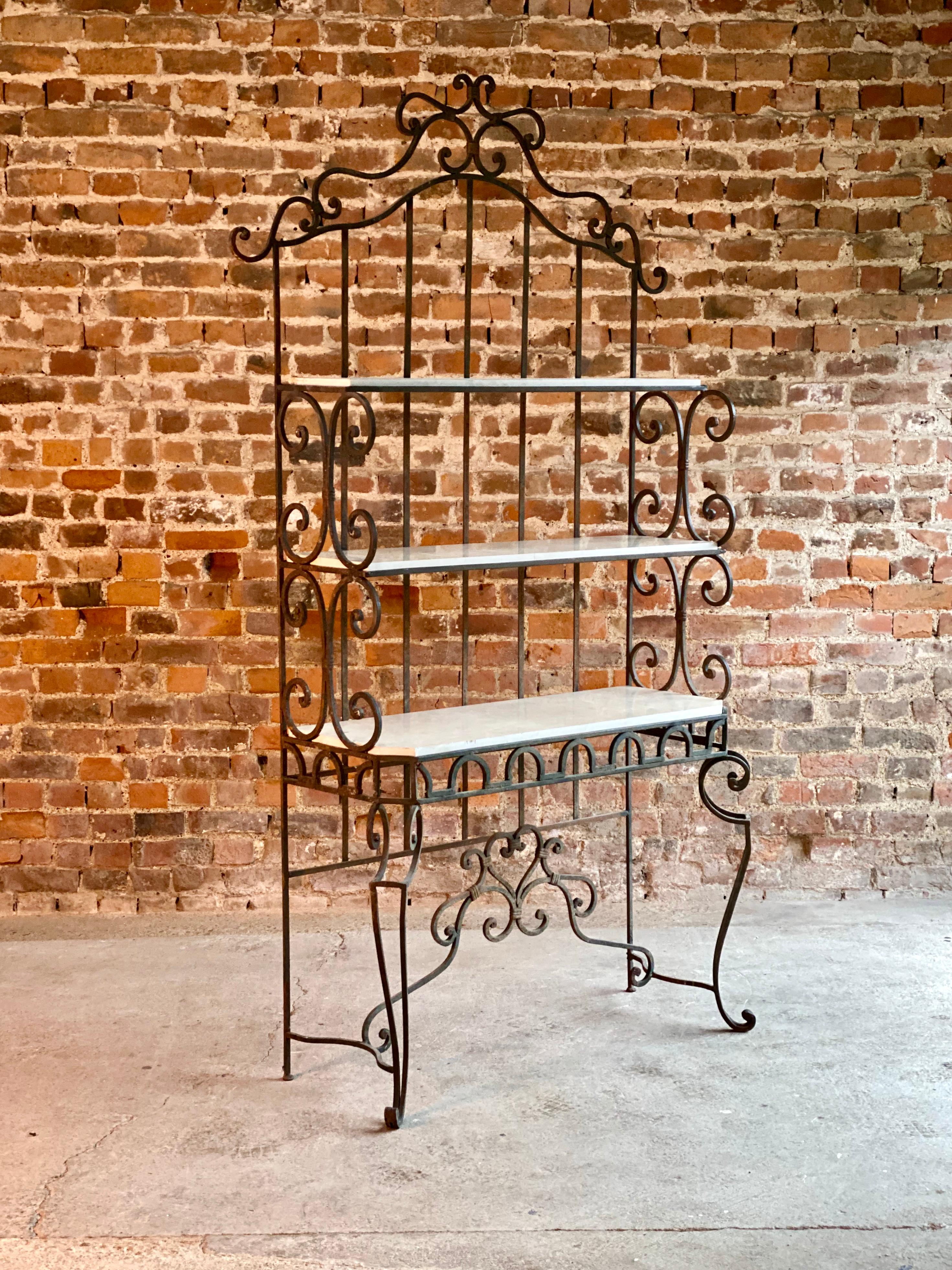 Magnificent French Boulangerie bread display stand, France circa 1890, the cast iron étagère stand having 3 marble lined shelves, ornate iron frame with scrolling detail, the white Carrara marble mounted shelves all raised on tall scrolling