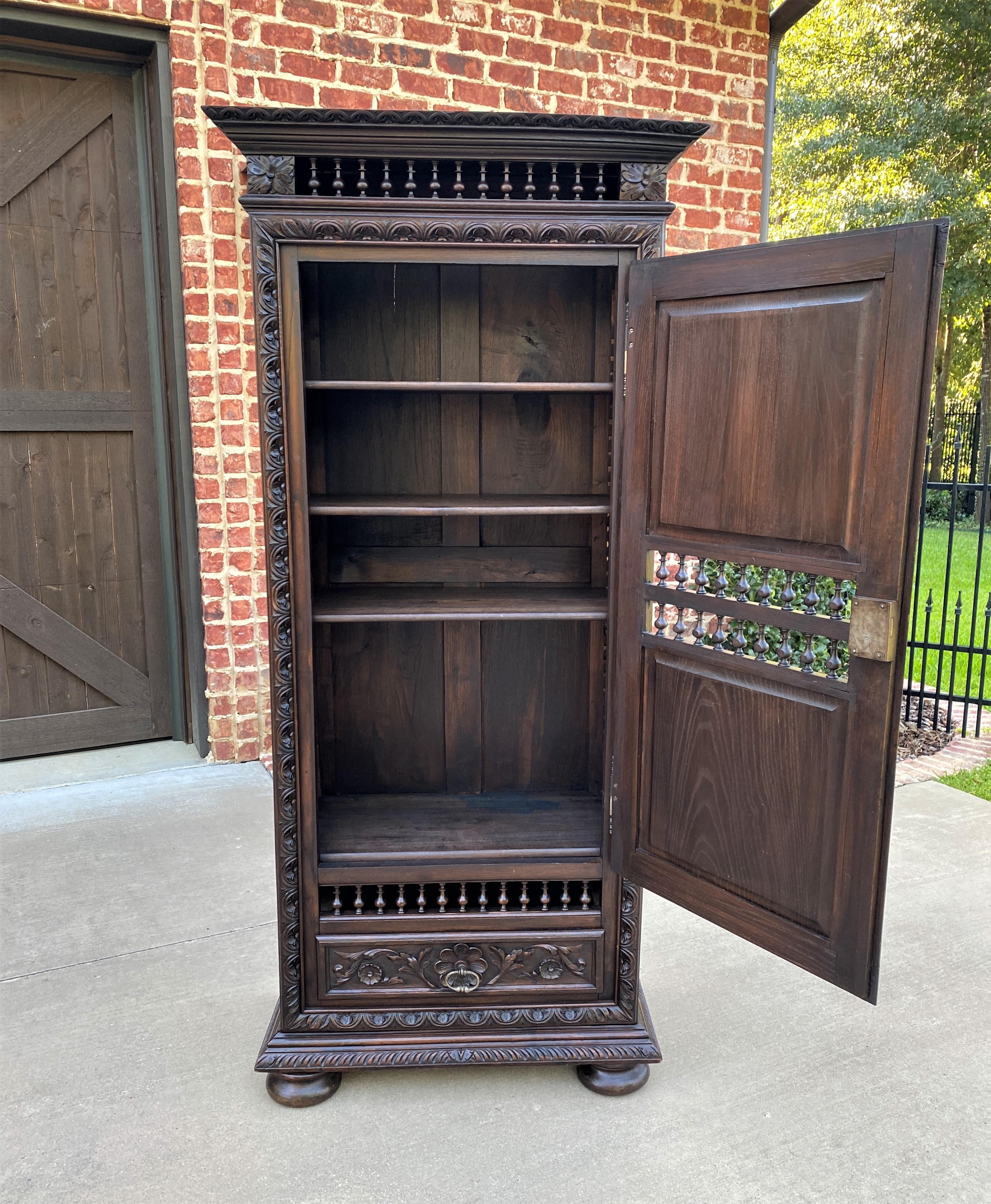 Beautiful 19th century antique French chestnut Breton Brittany cabinet, bookcase, armoire, or wardrobe with interior shelves and lower drawer ~~c. 1880s

Charming carved chestnut cabinet, 