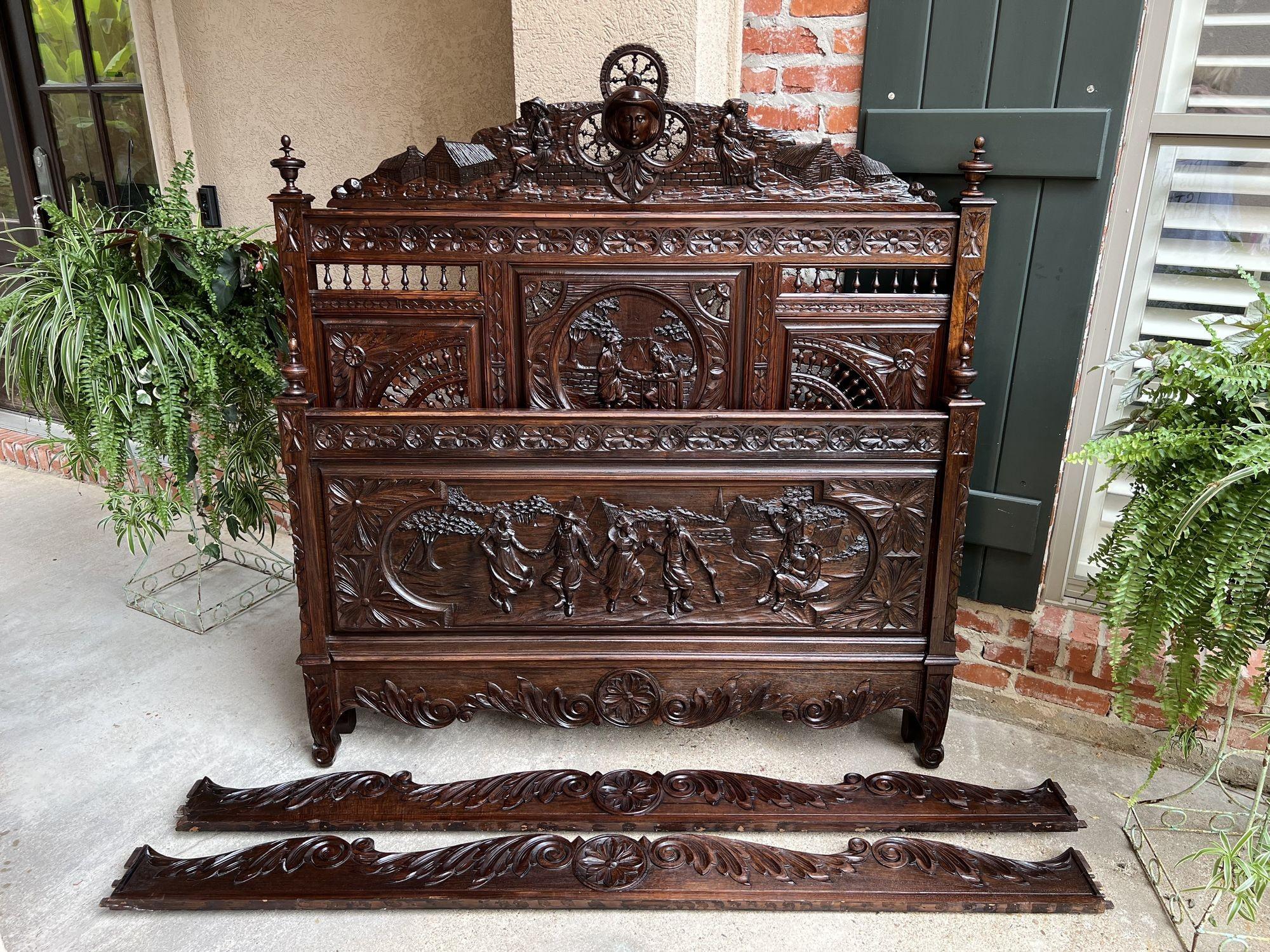 19th century French Breton Bed Carved Oak Brittany Wedding French Country.

Unique antique French bed, direct from the Brittany region, highly carved with details particular to the Breton style. Most probably a commissioned piece for the wedding bed