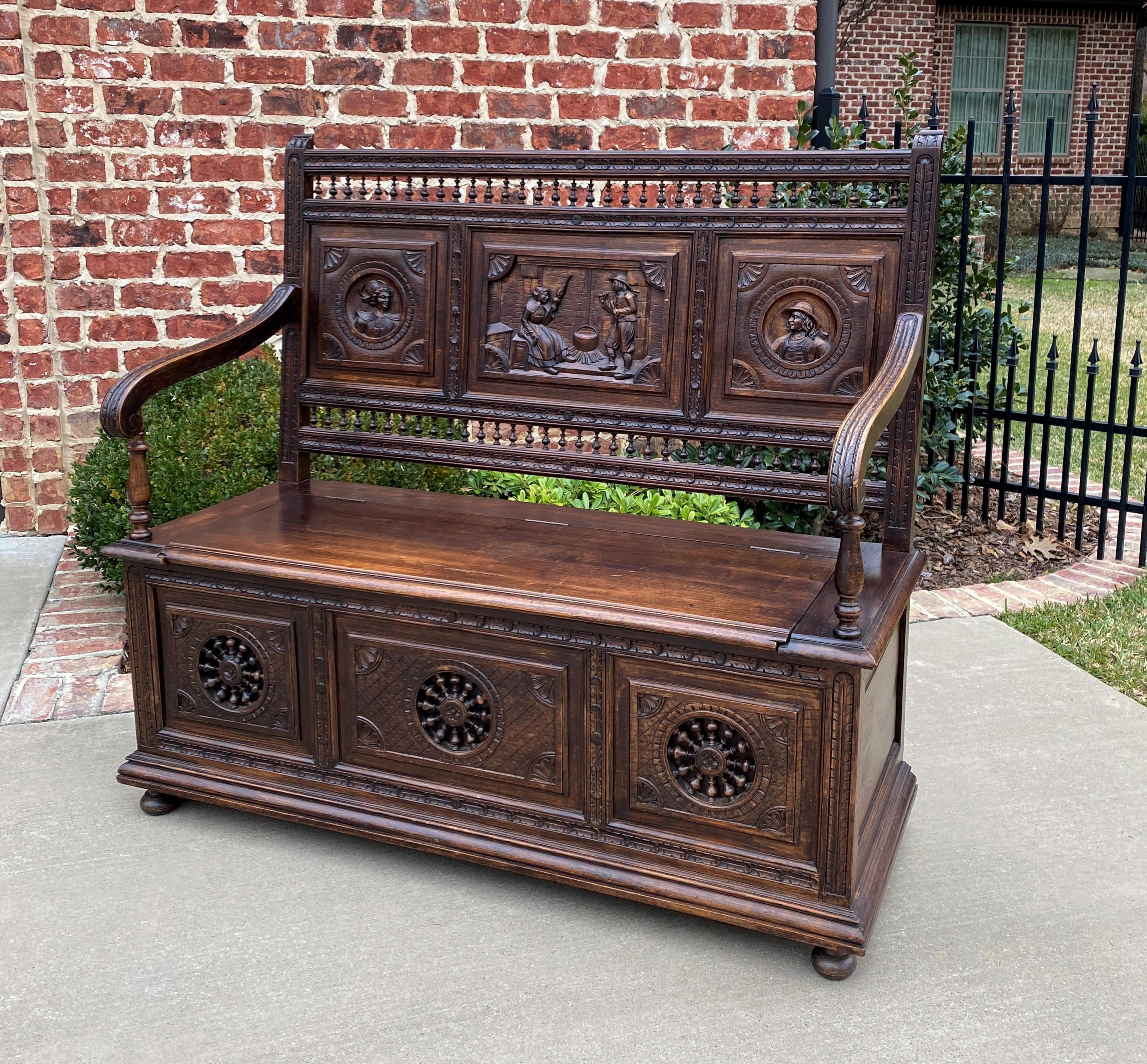 Highly carved oak antique French Breton bench or settee with lift top seat~~c. 1880s

Classic French Breton design~~Breton (sometimes known as Brittany) furniture originated in late 19th century France in a region to the west of Normandy, surrounded