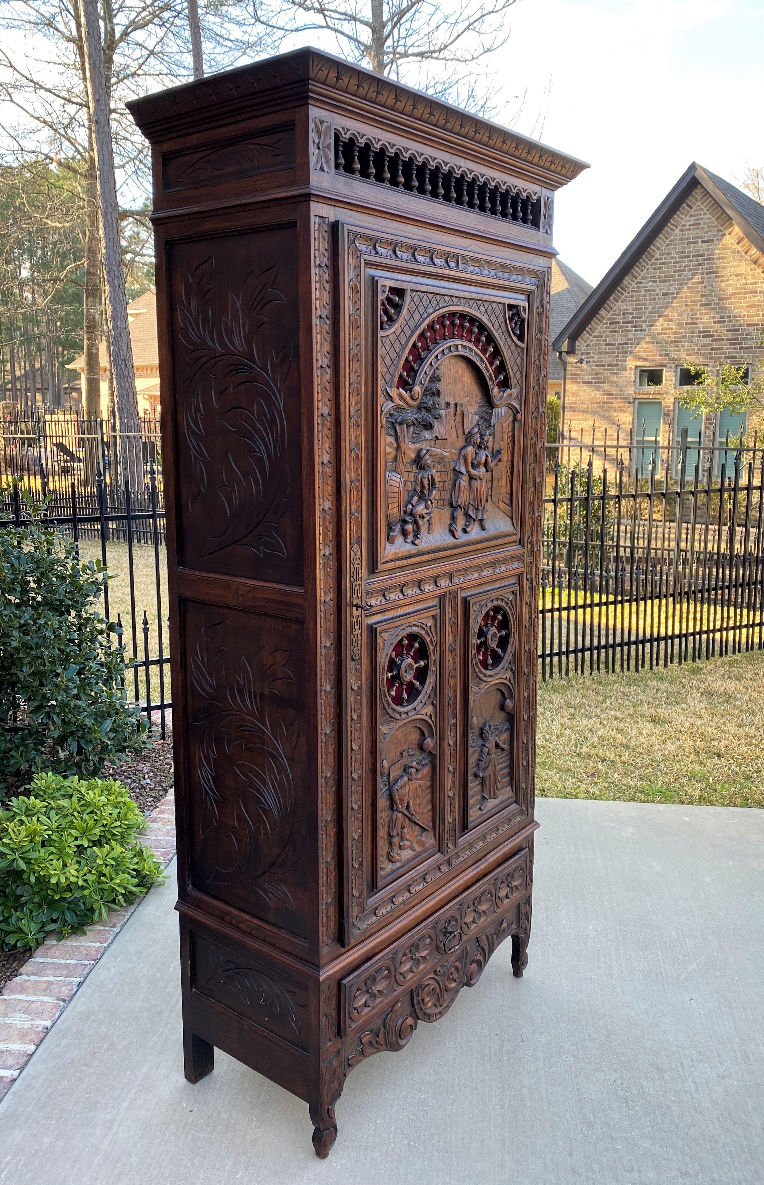 Beautiful 19th century antique French oak Breton Brittany cabinet, Bonnetiere, armoire, or wardrobe with interior shelves ~~Tall~~c. 1880s

Charming carved oak cabinet or 