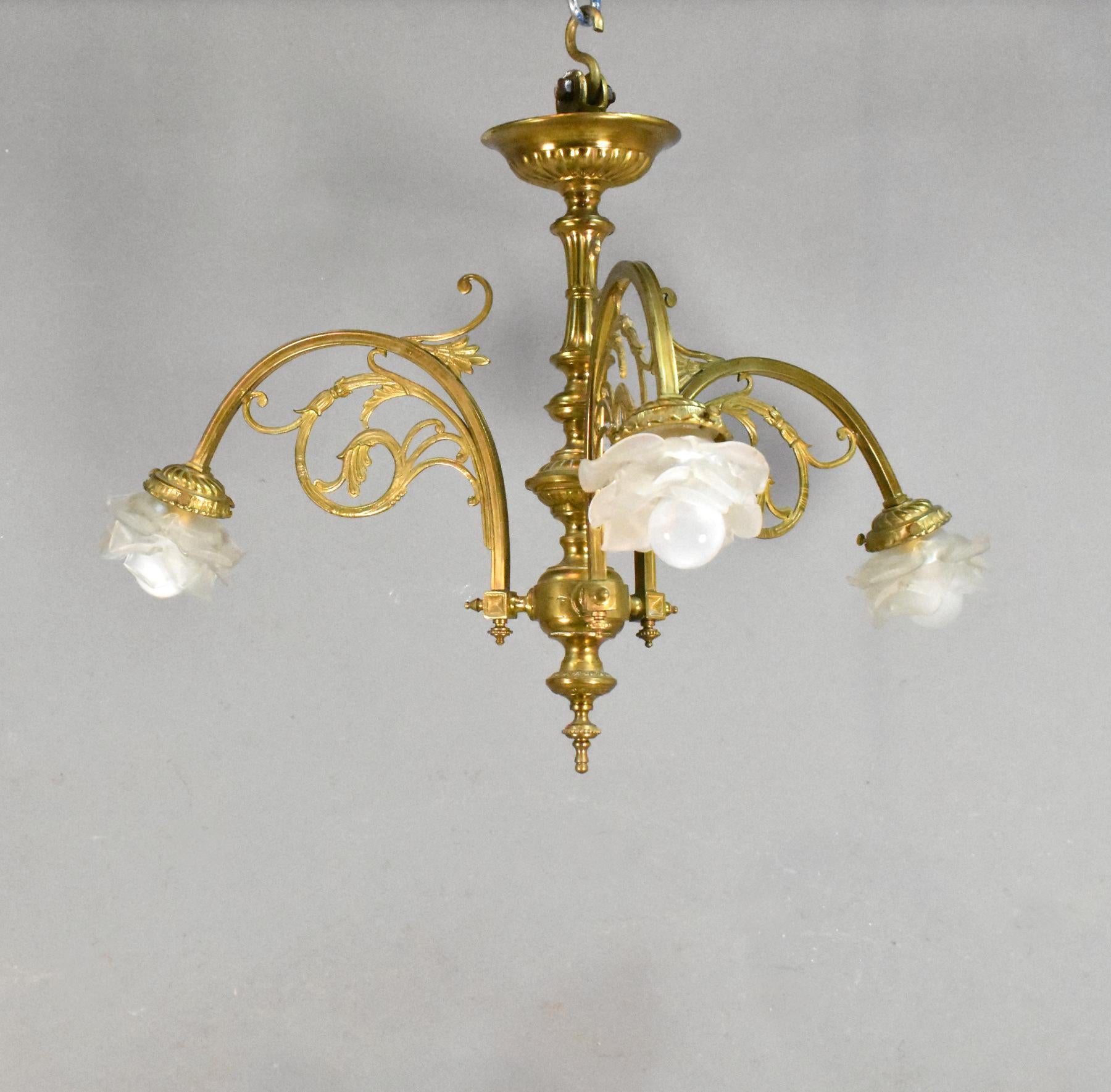 Antique French bronze 3 light chandelier

This well-proportioned three light / arm bronze chandelier has floral frosted glass light shades. 

The three bronze arms originating from the ornate central column, have out-swept floral decorations. 

A