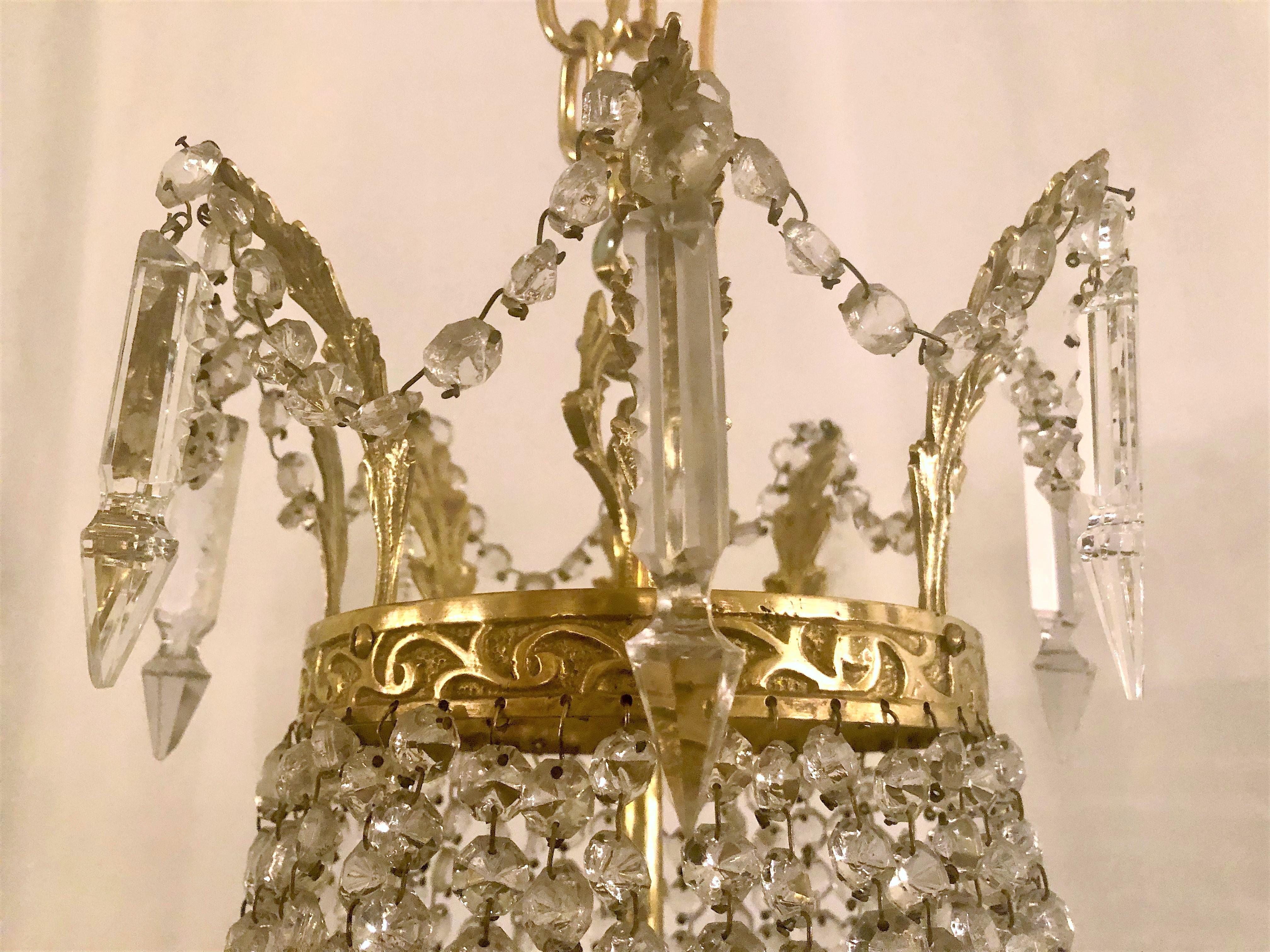 Antique French bronze and crystal chandelier.